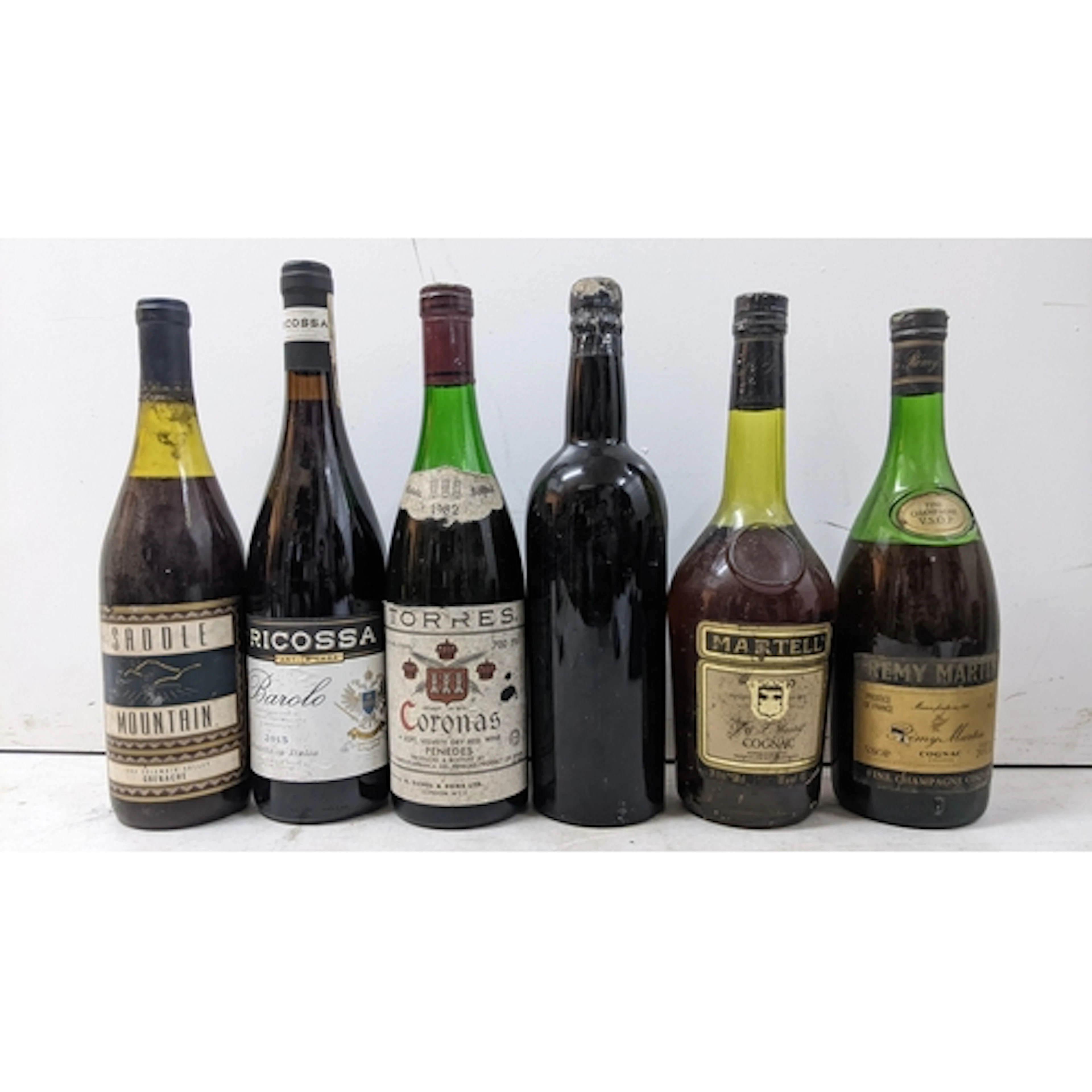 A mixed group of six bottles of Port, Cognac and wine, compr...