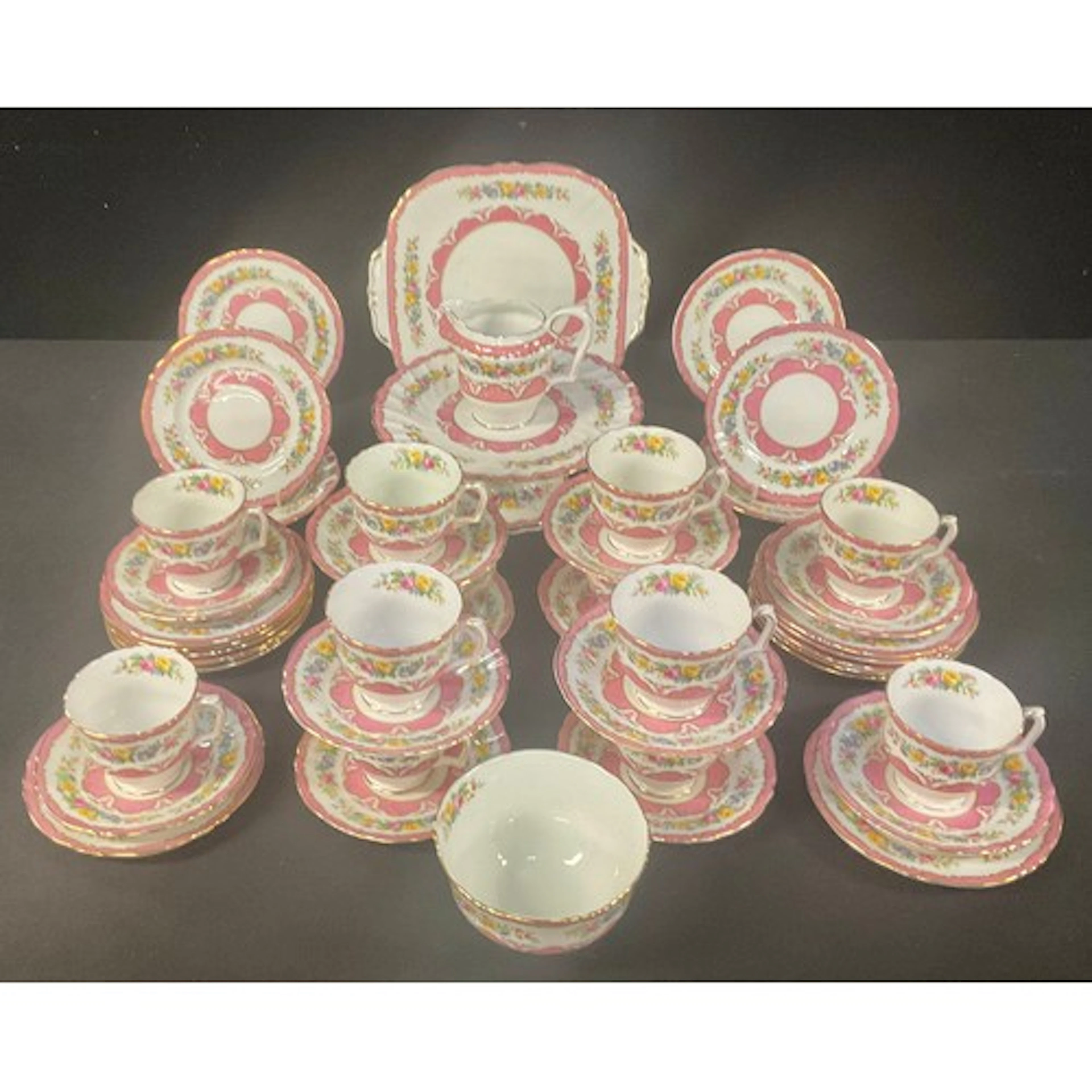 A Crown Staffordshire Lyric Tunis pattern tea service for tw...