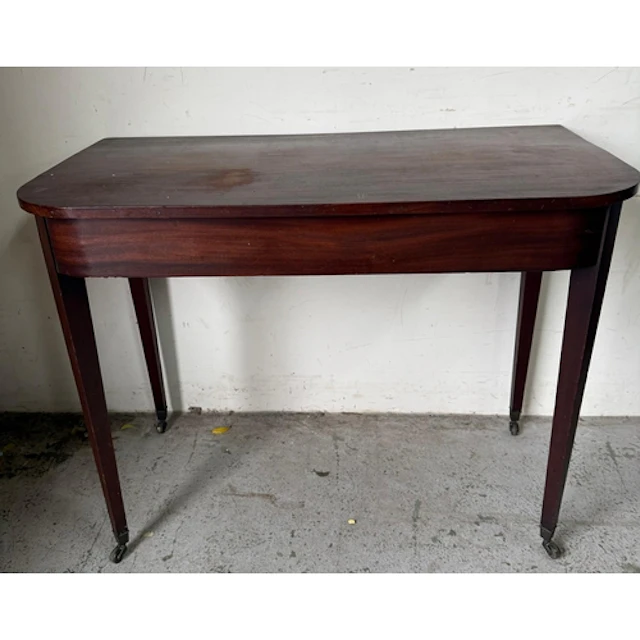 A Mahogany console table on tapering legs