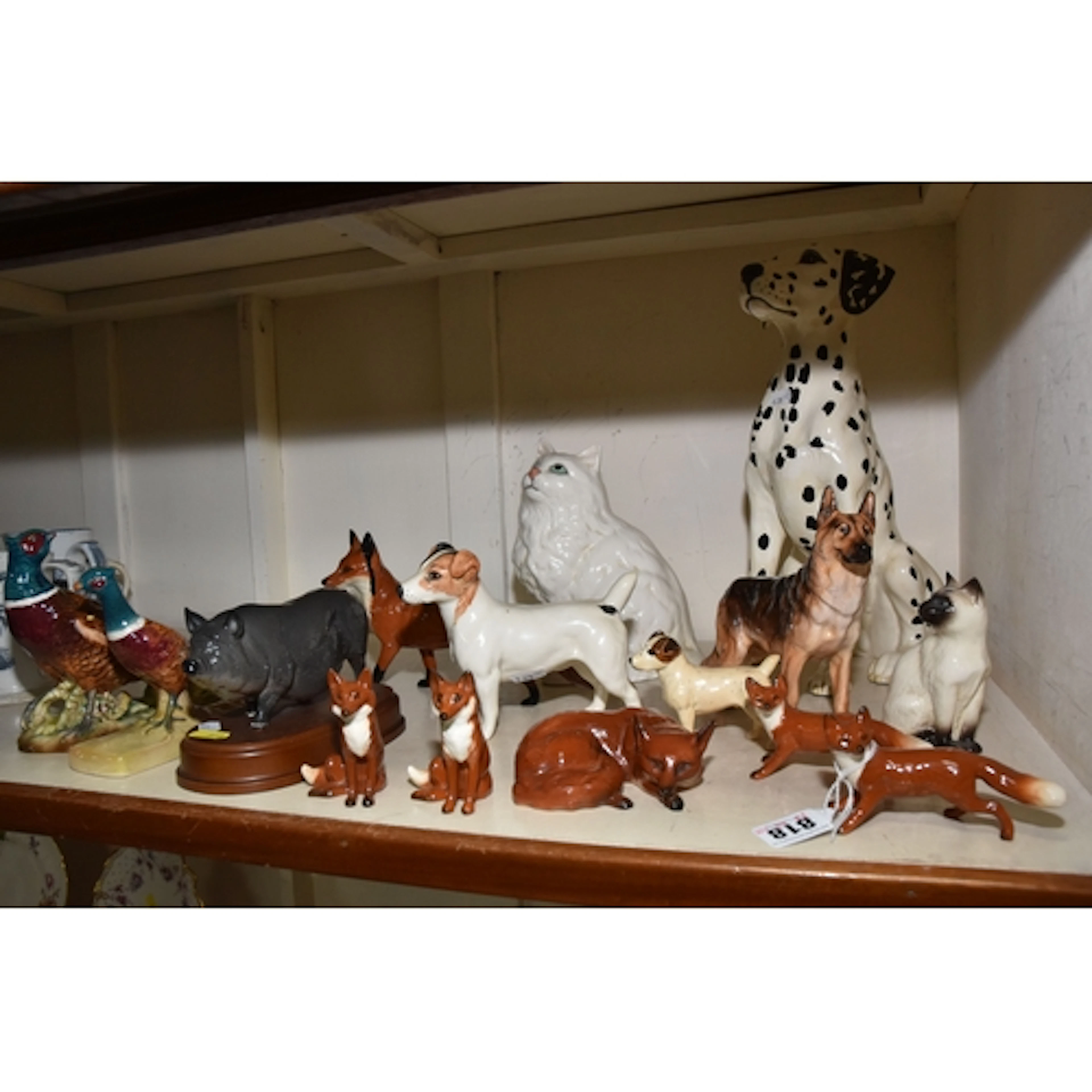 A GROUP OF BESWICK AND ROYAL DOULTON ANIMALS, comprising Bes...