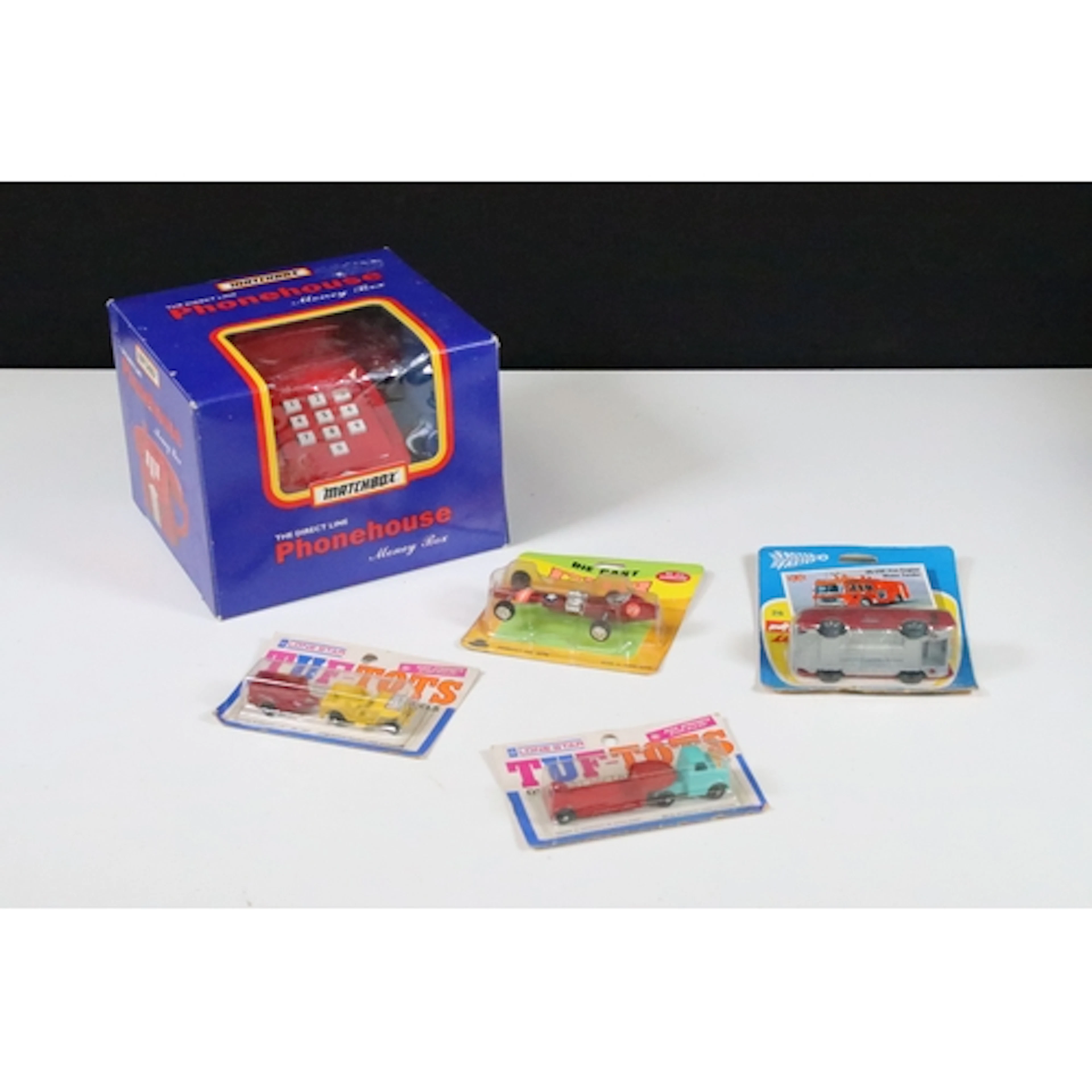 Four carded diecast models to include 2 x Lone Star Tuf-Tots...