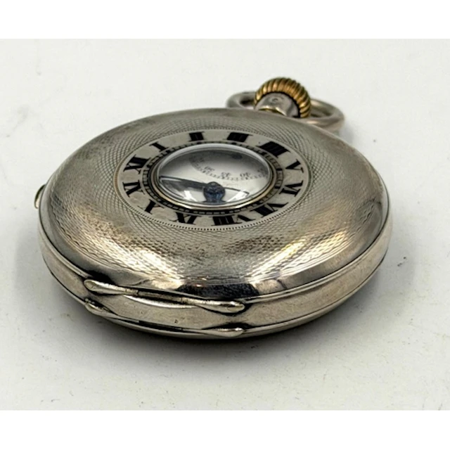 A Half Hunter continental silver, marked 800, pocket watch...