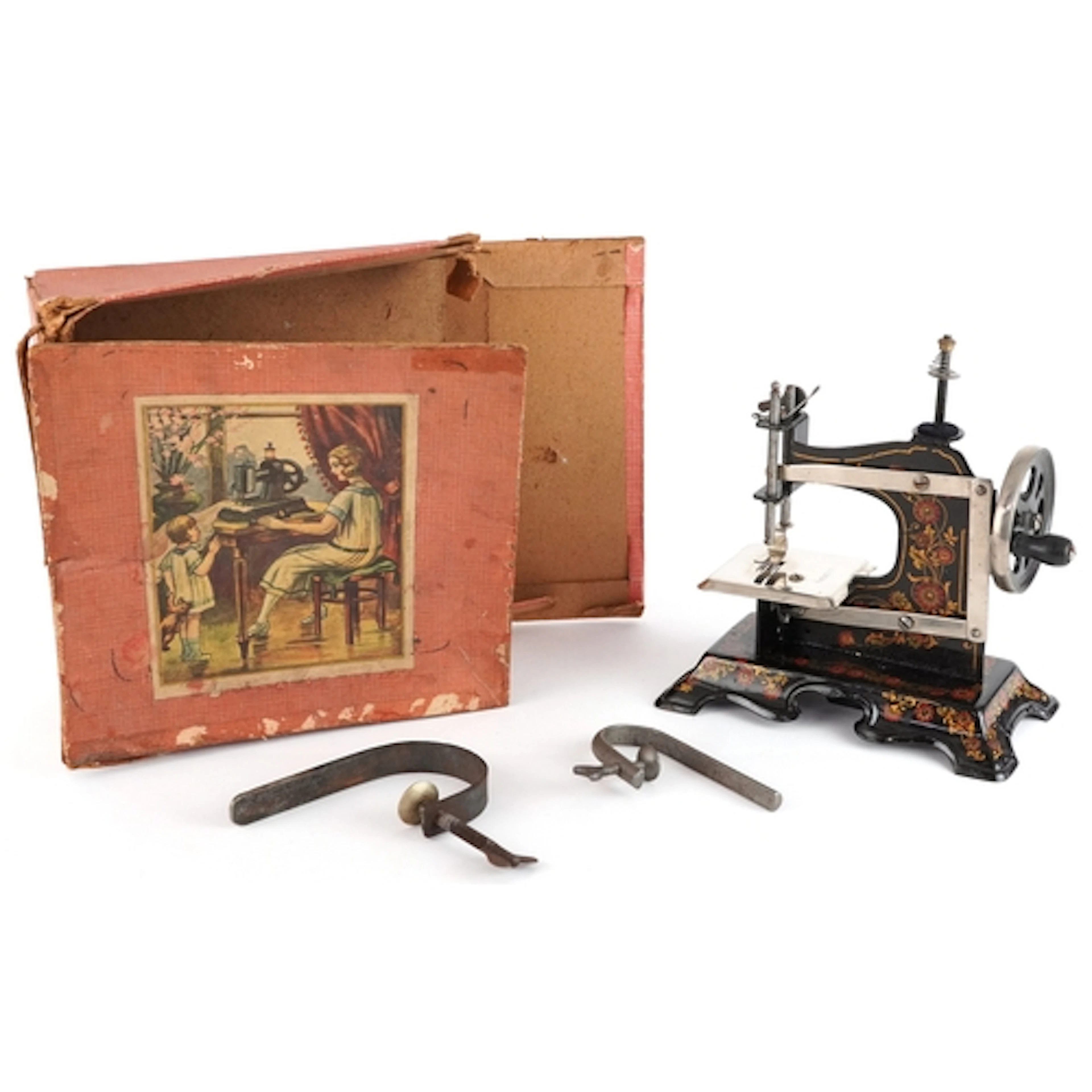 Vintage black German enamel child's sewing machine with box,...