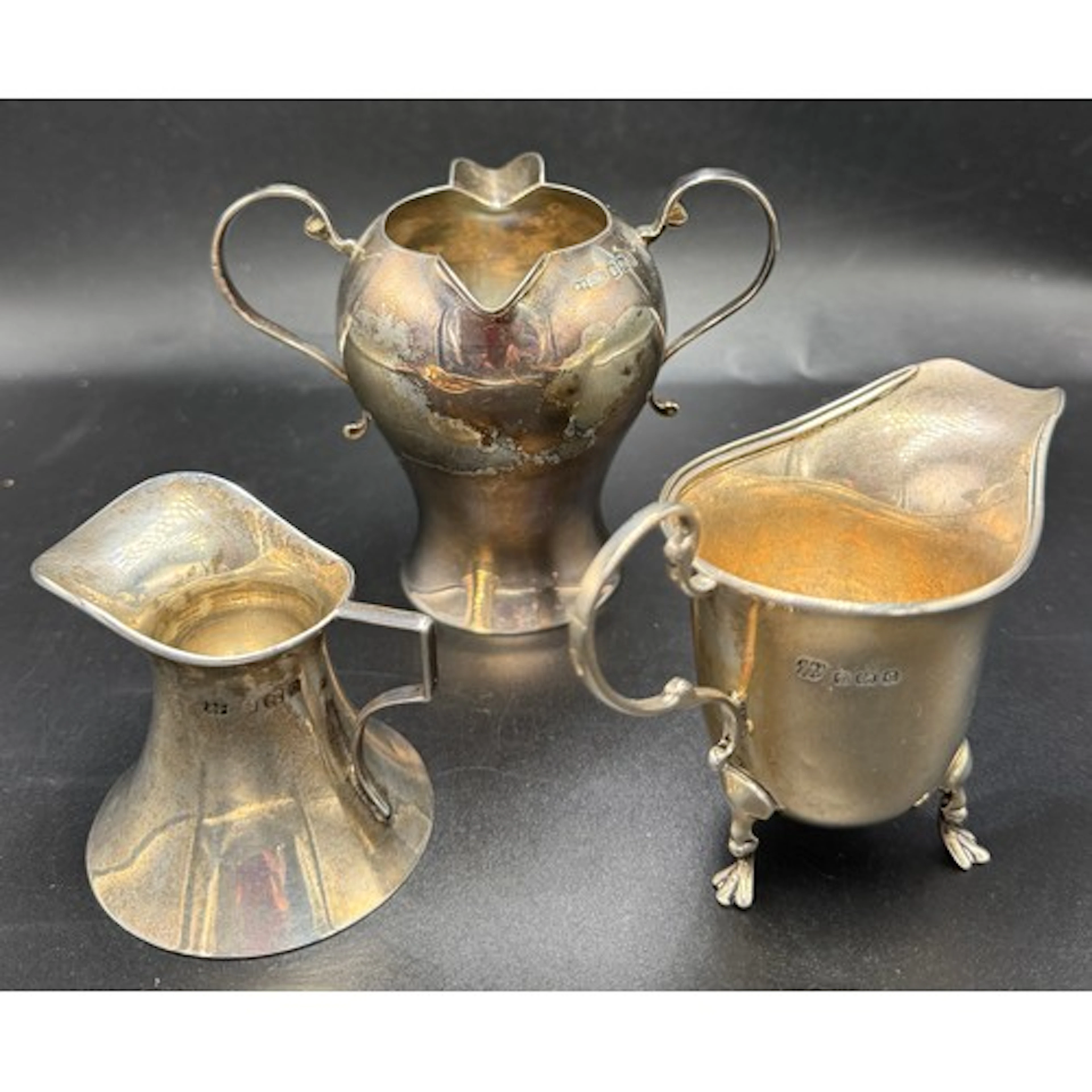 Three hallmarked silver jugs to include Birmingham 1902, mak...