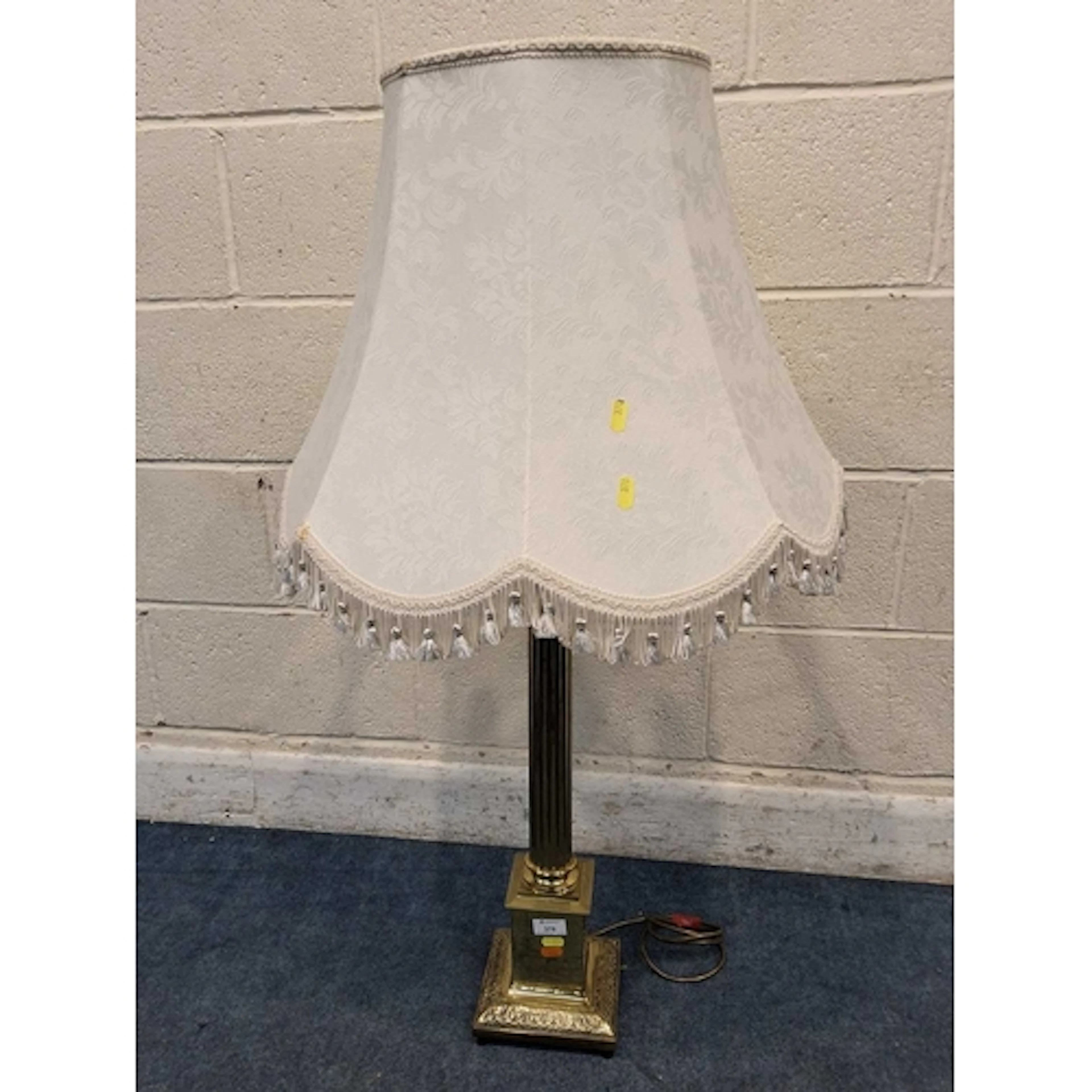 A BRASS CORINTIHIAN STYLE TABLE LAMP, with a box plinth and ...