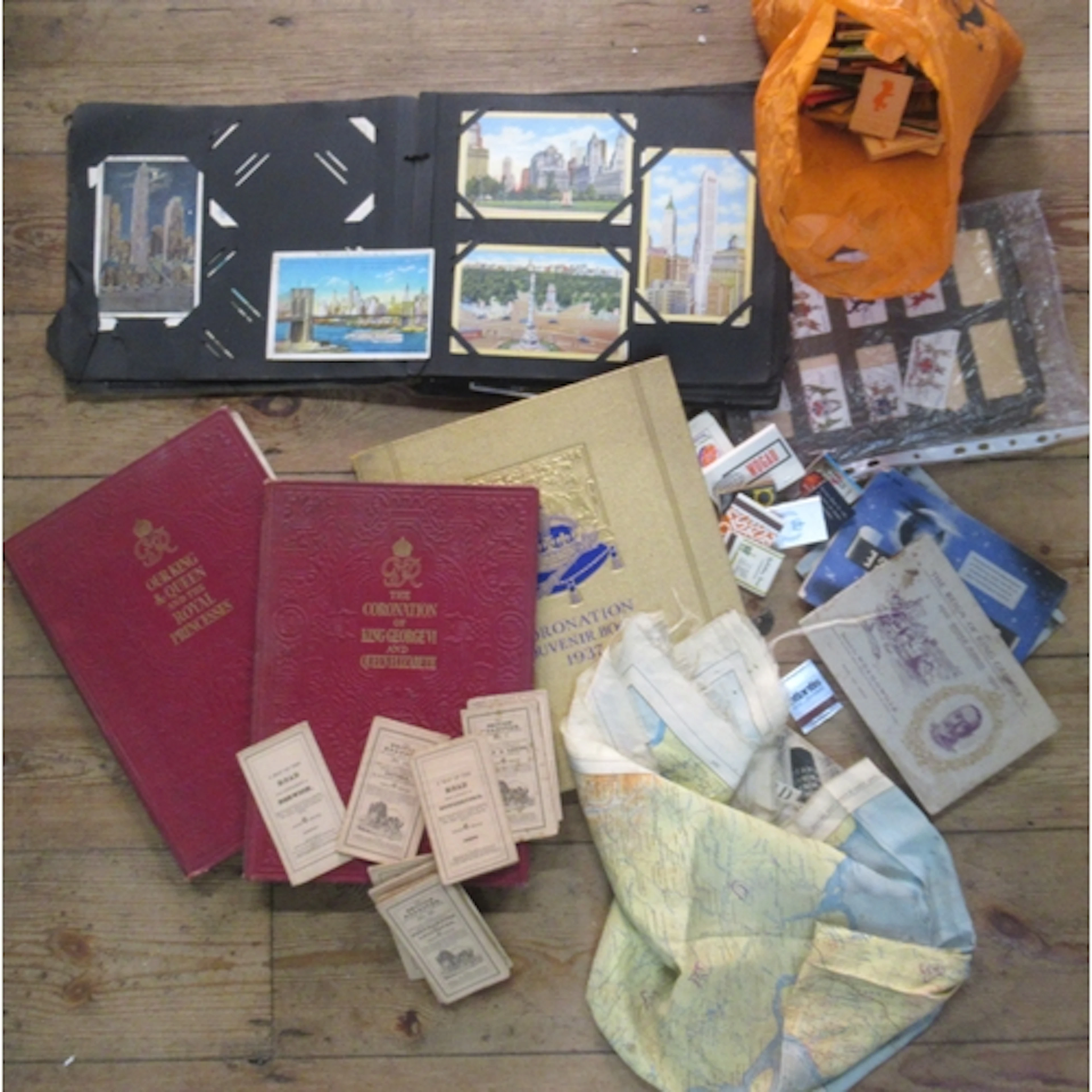 A collection of items, to include postcards, cigarette cards...
