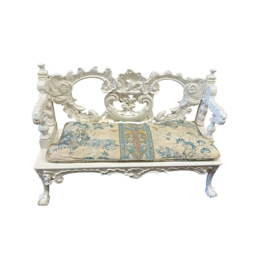 A white painted Baroque revival window seat, with C-scroll a...