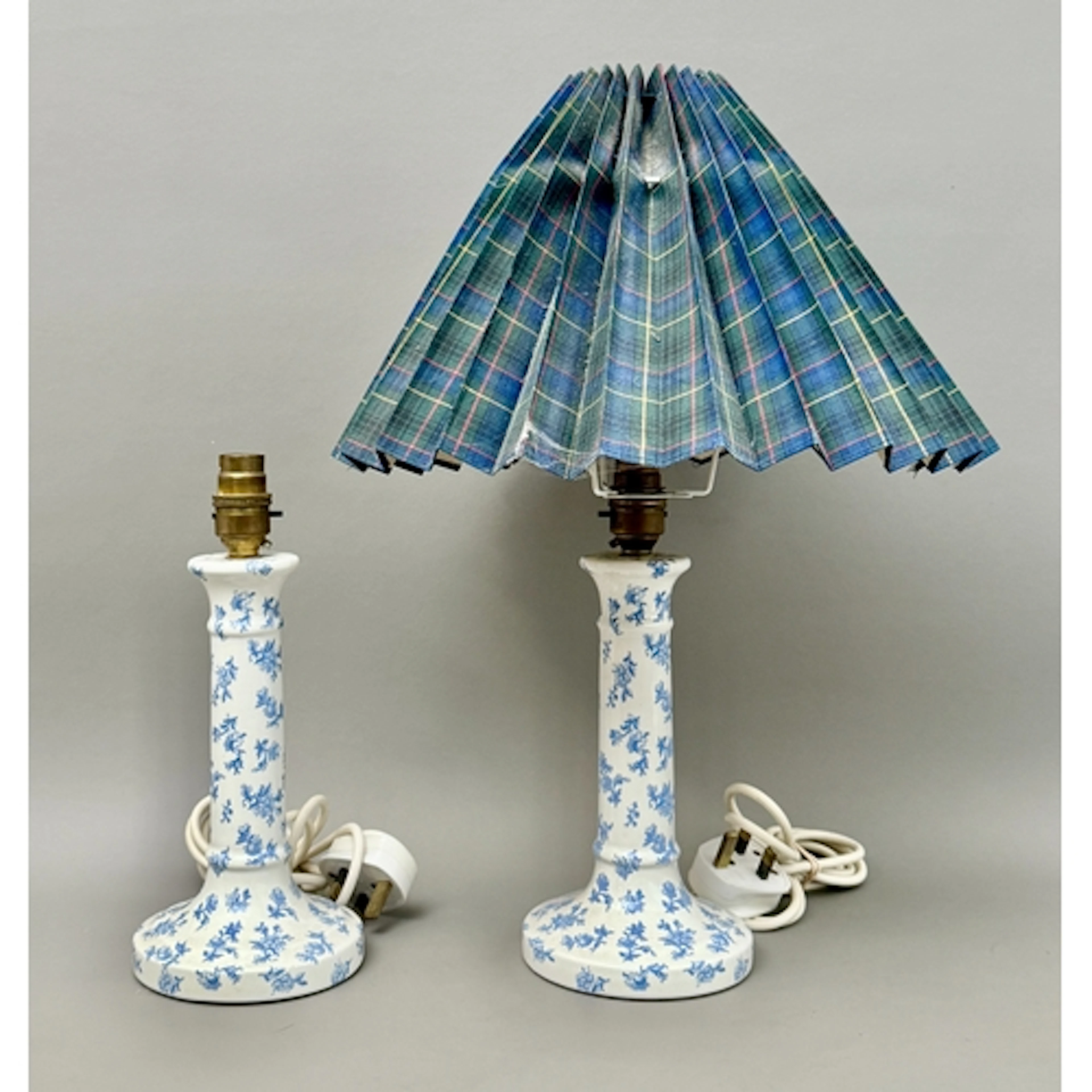 A pair of Laura Ashley Home ceramic table lamps with a blue ...
