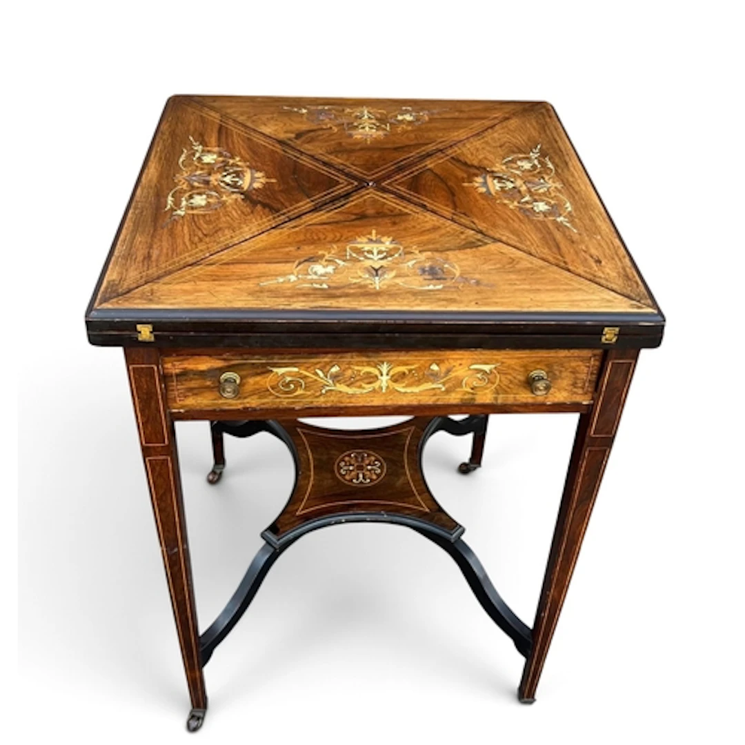 A LATE VICTORIAN ROSEWOOD ENVELOPE GAMES TABLE 74cm x 55cm x...