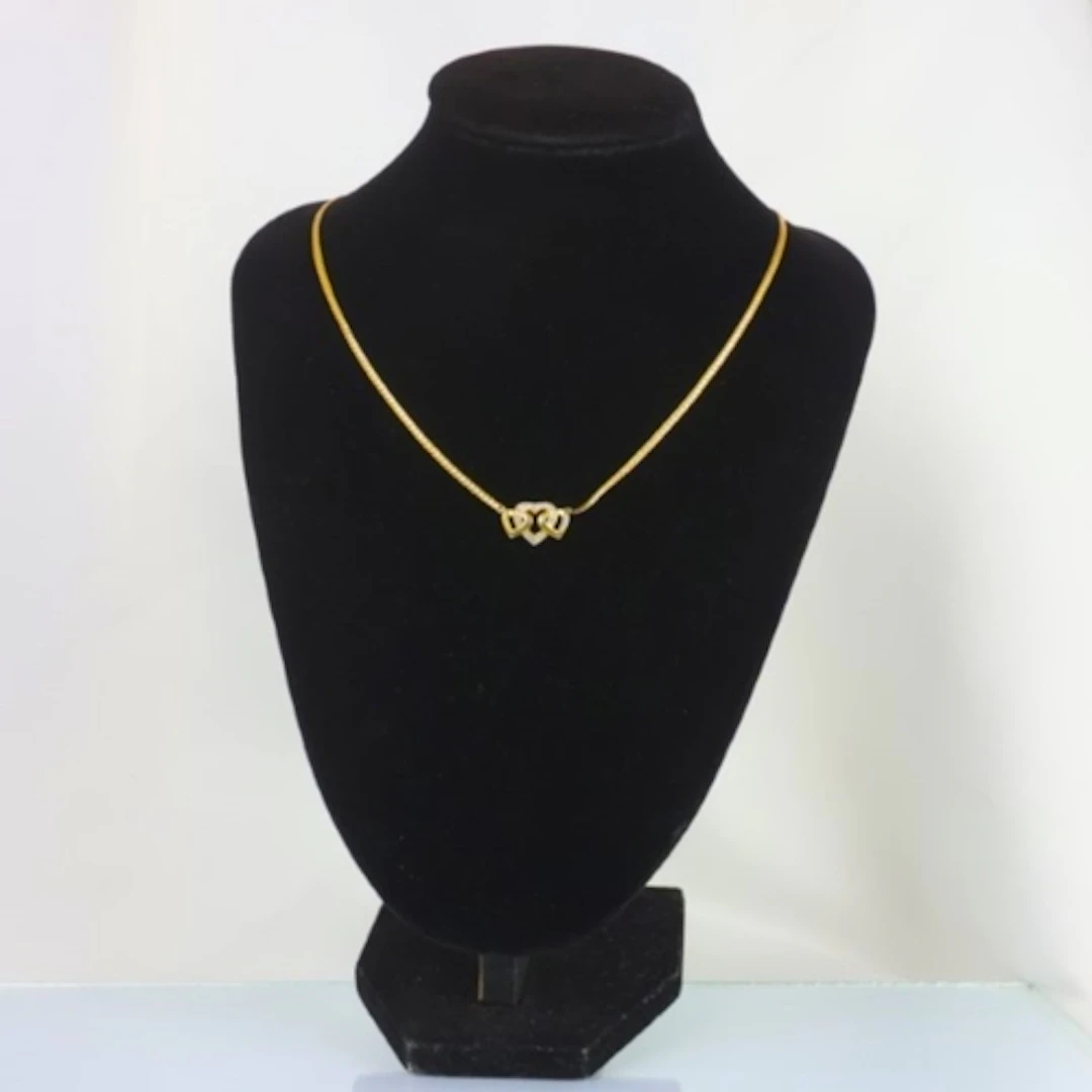A contemporary yellow metal necklace, the snake link style c...