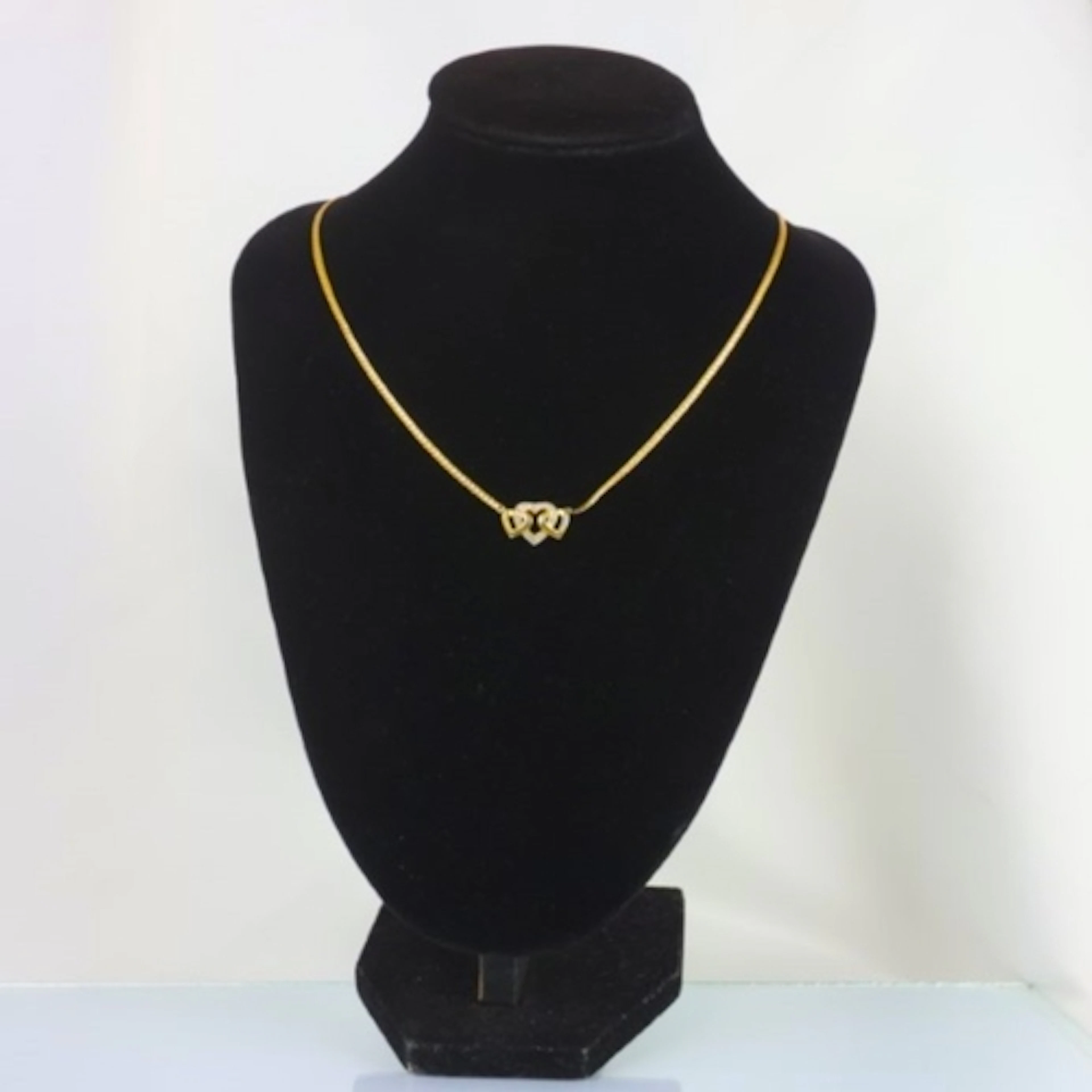 A contemporary yellow metal necklace, the snake link style c...