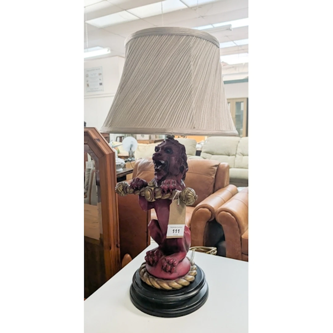 A decorative Red Lion table lamp with shade