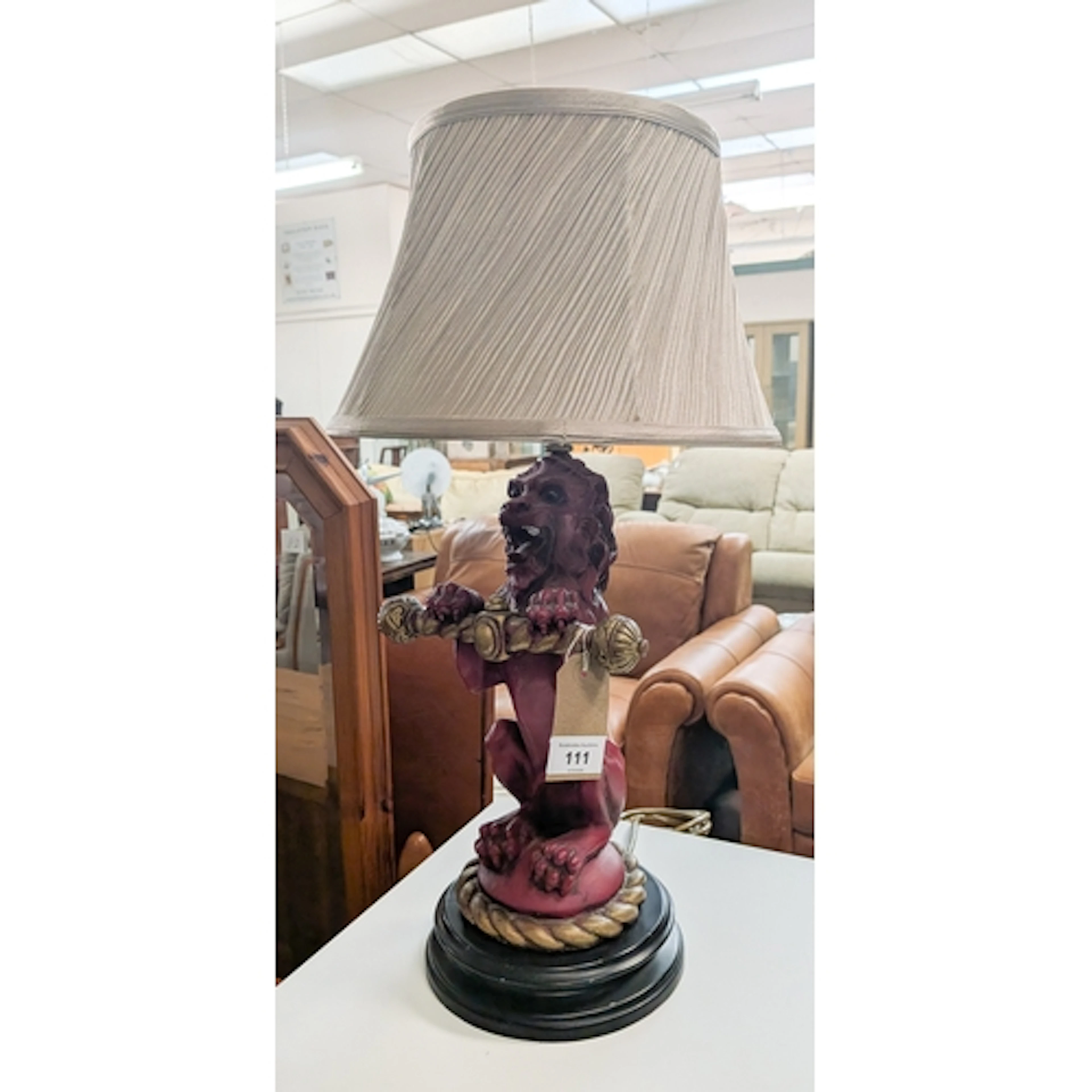 A decorative Red Lion table lamp with shade