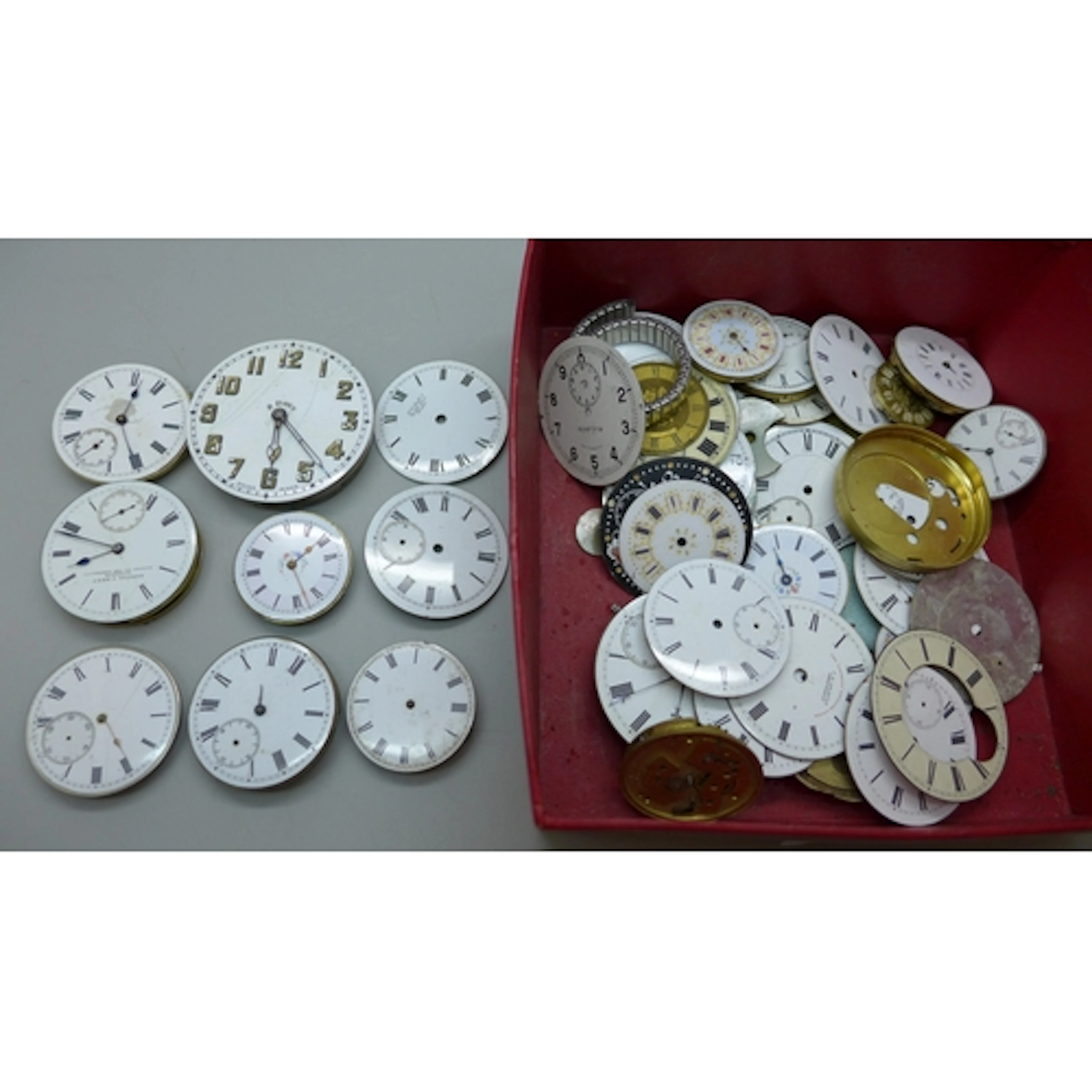 A collection of pocket watch movements and dials