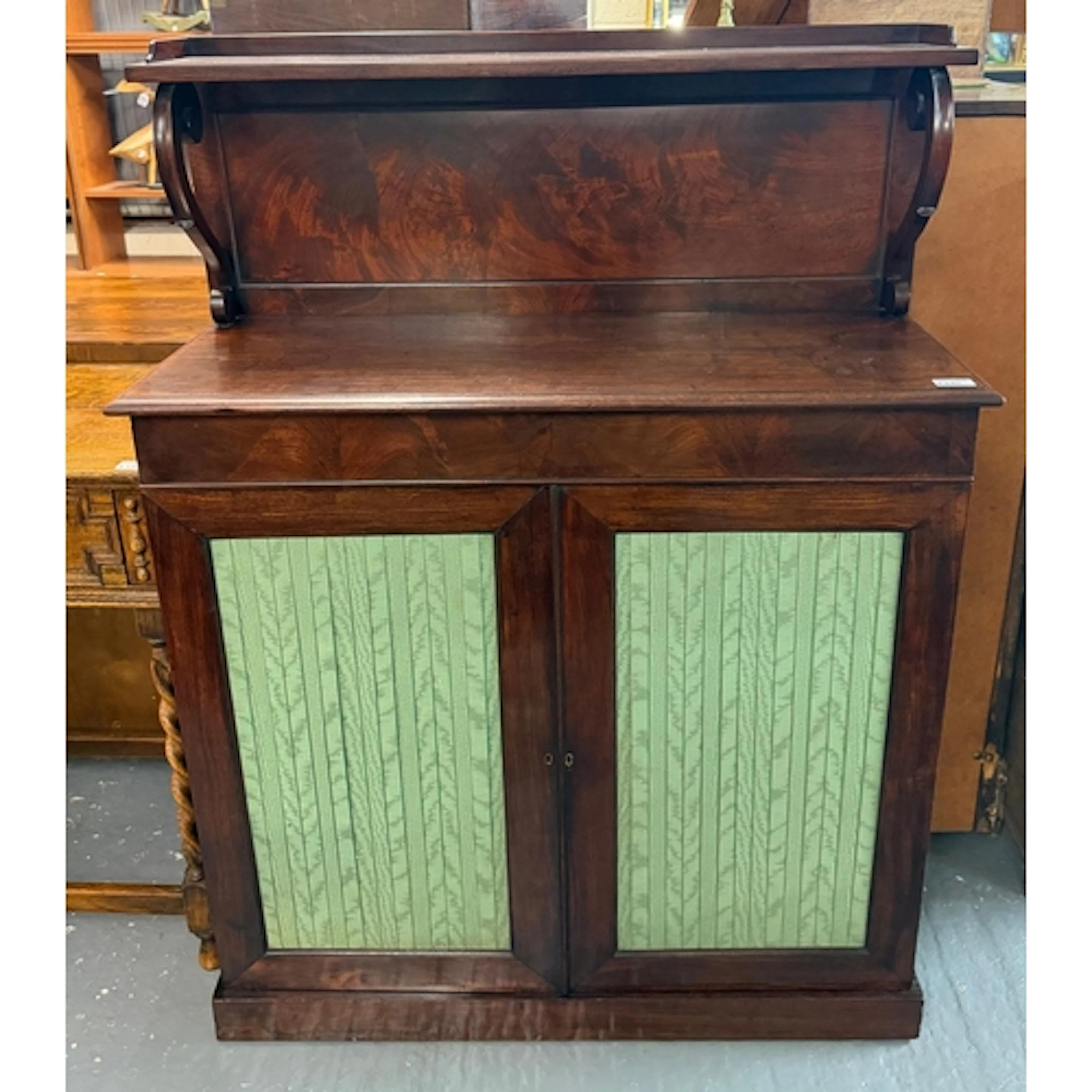George IV mahogany chiffonier with over-shelf, on scroll sup...