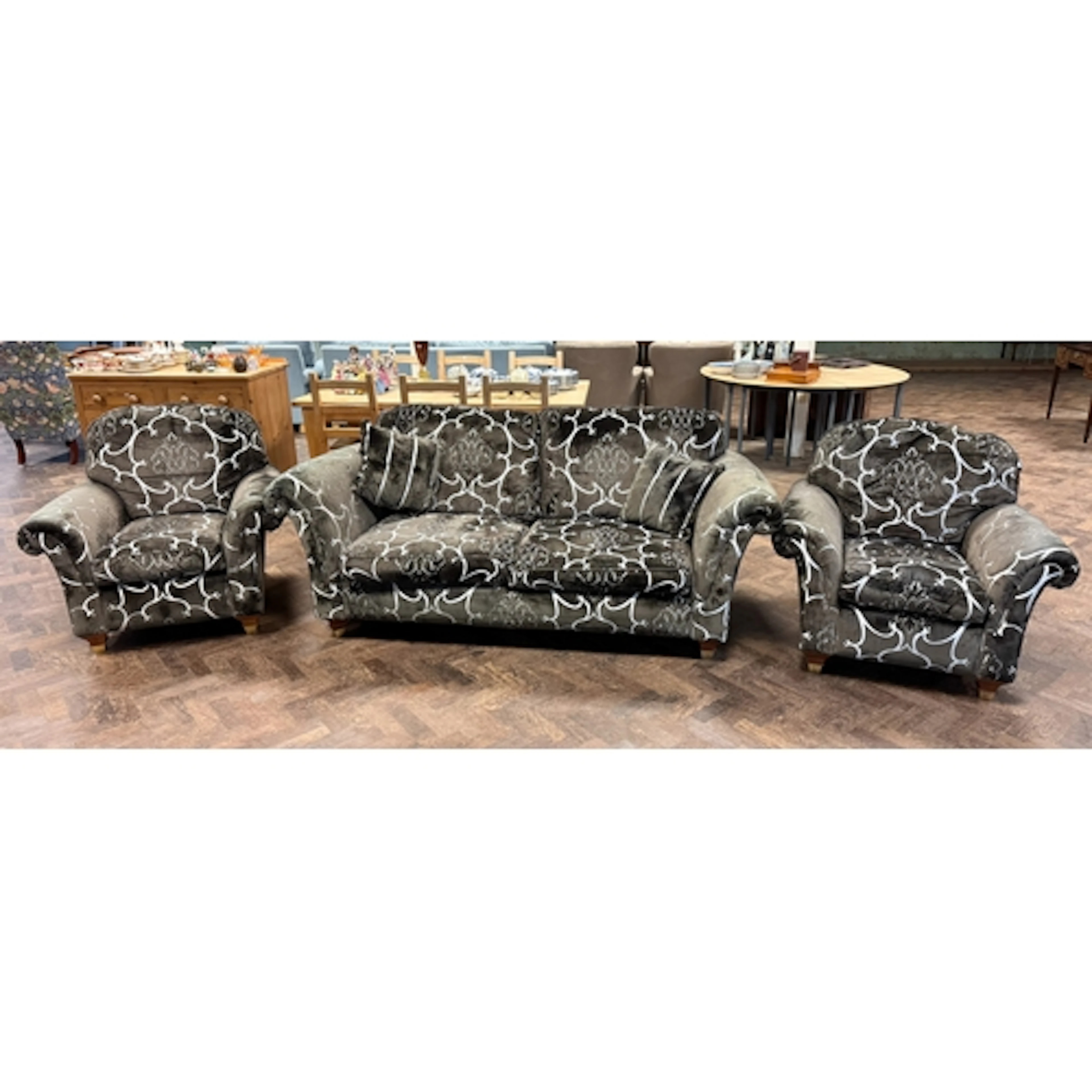 A modern two seater three piece lounge suite comprising a tw...