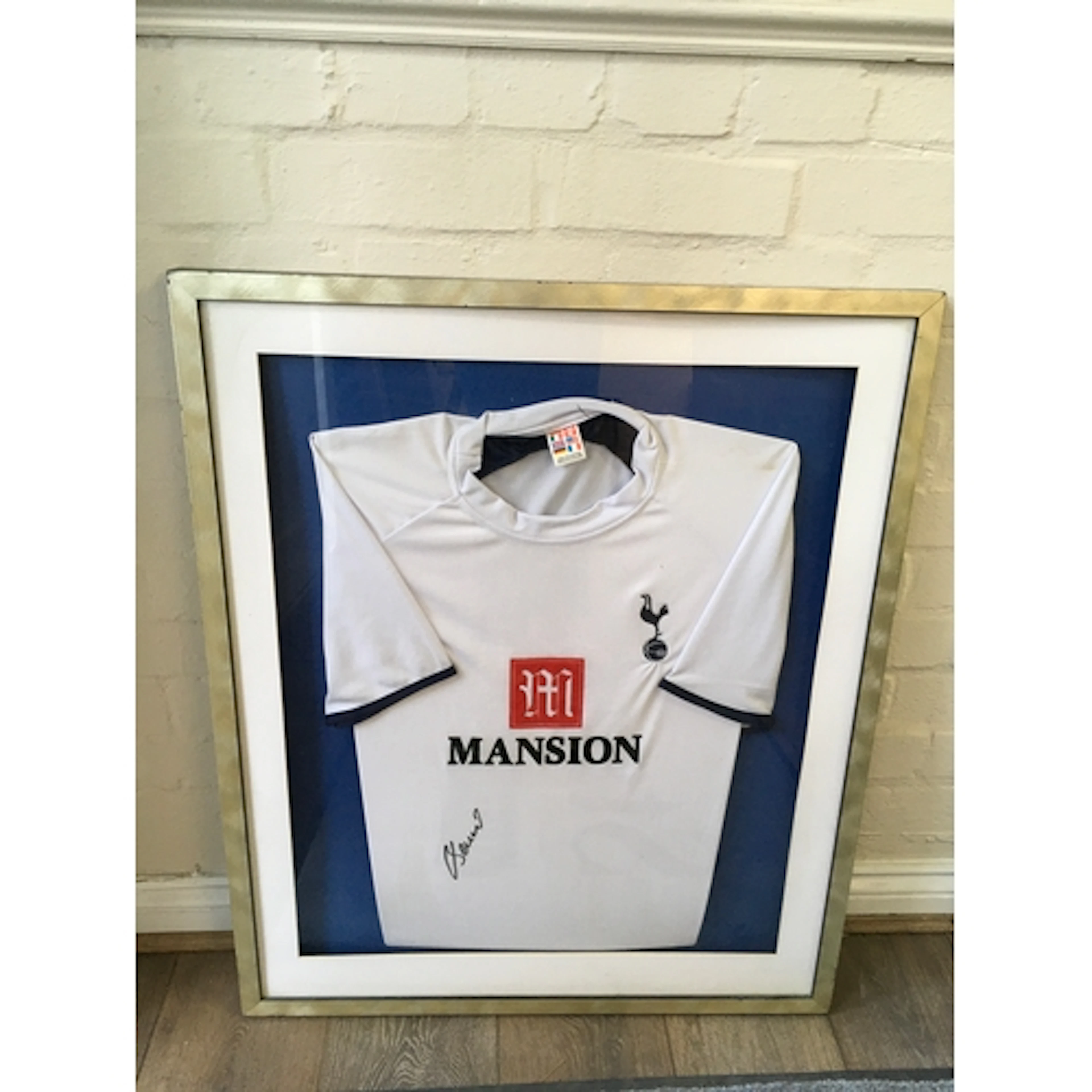 A framed signed Tottenham Hotspurs football shirt. Approx W6...