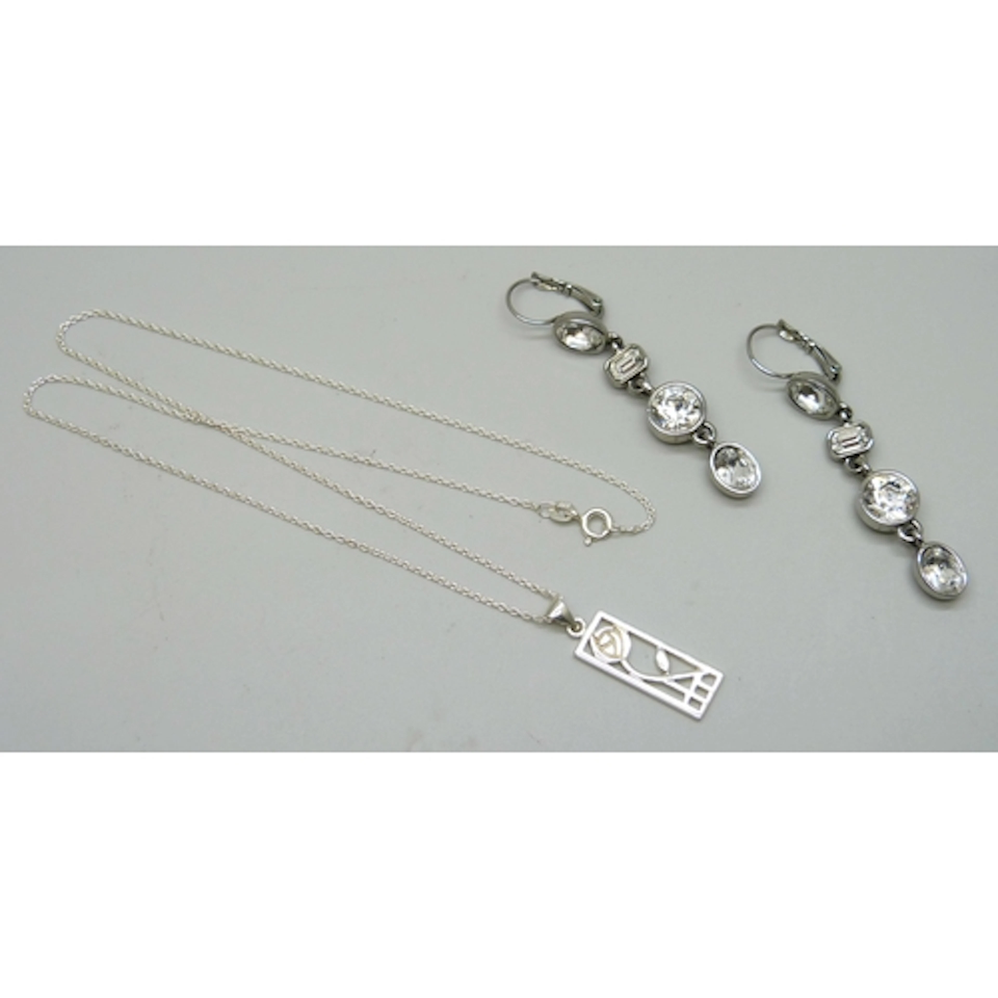 A pair of Dyrberg Kern drop earrings, and a silver pendant o...