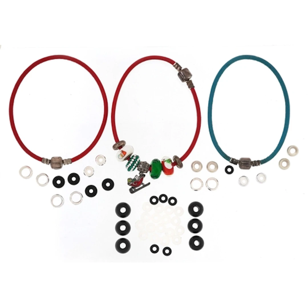 Charm bracelets including silver overlaid charms, the larges...