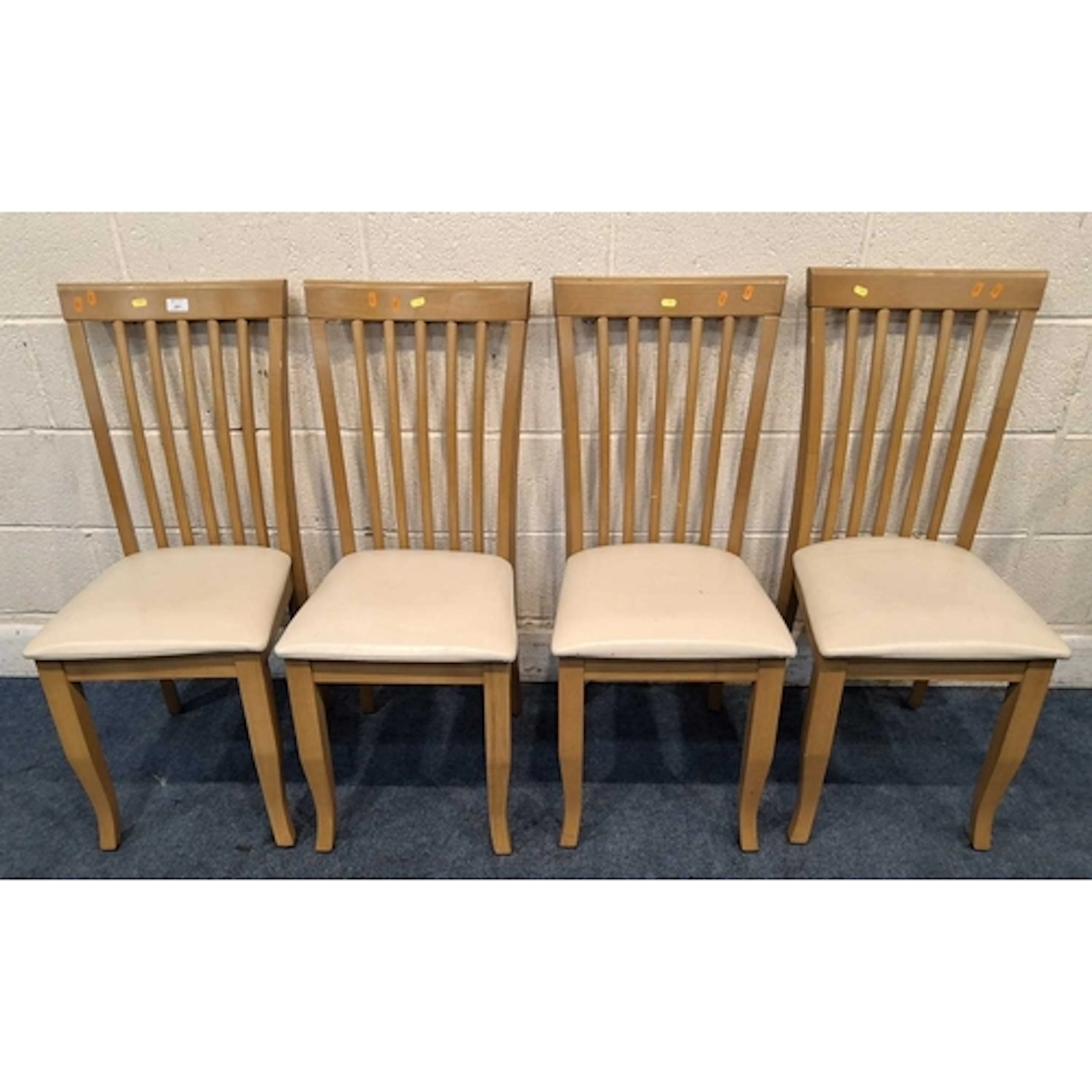 A SET OF FOUR JULIAN BOWEN CHAIRS, with cream leatherette up...