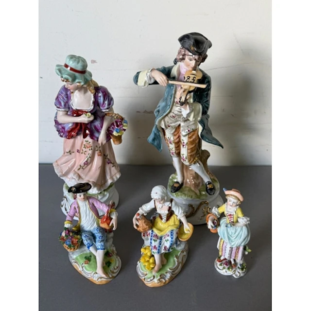 A selection of ceramic figurines variuse styles and ages, in...
