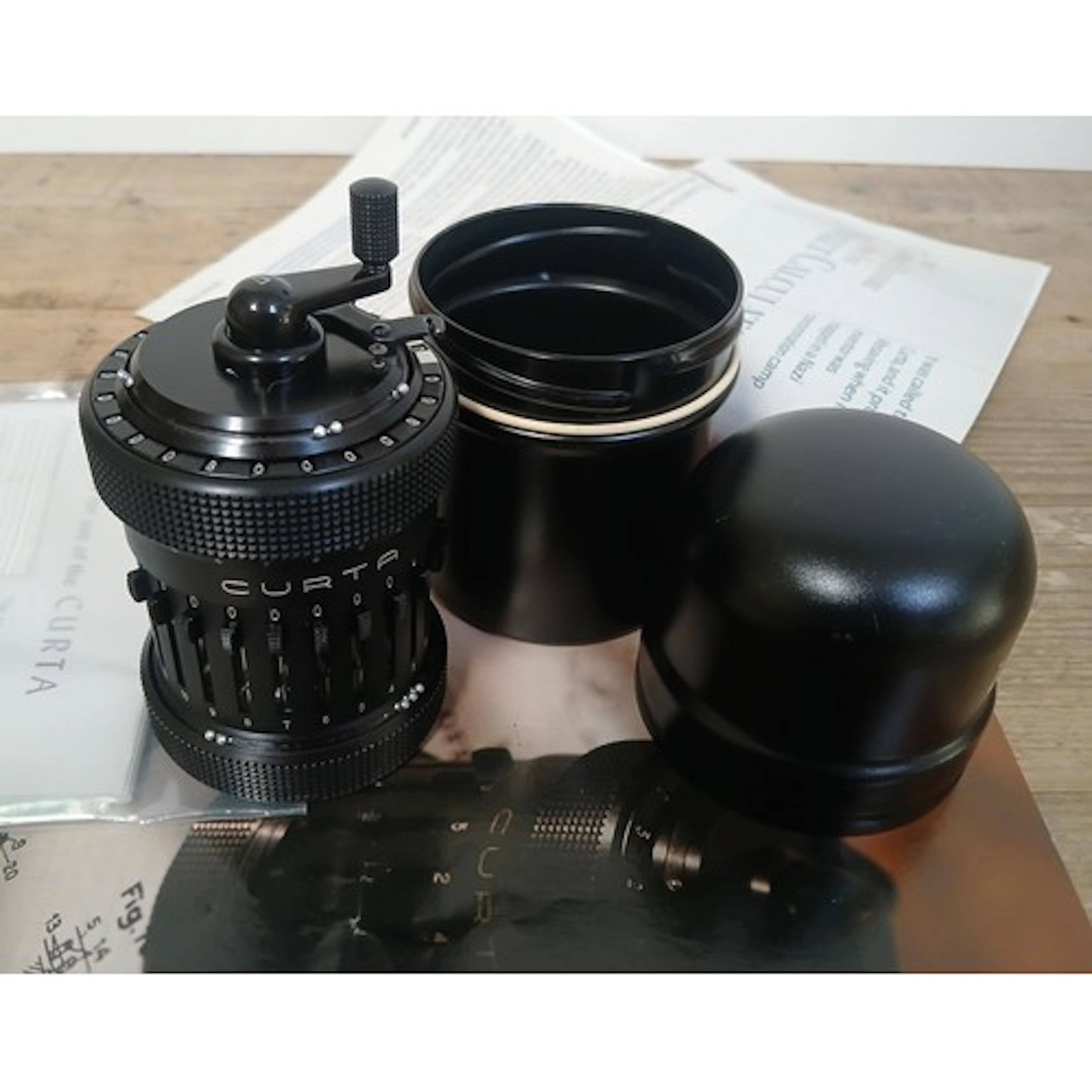A Curta type one mechanical pocket calculator by Contina Ltd...