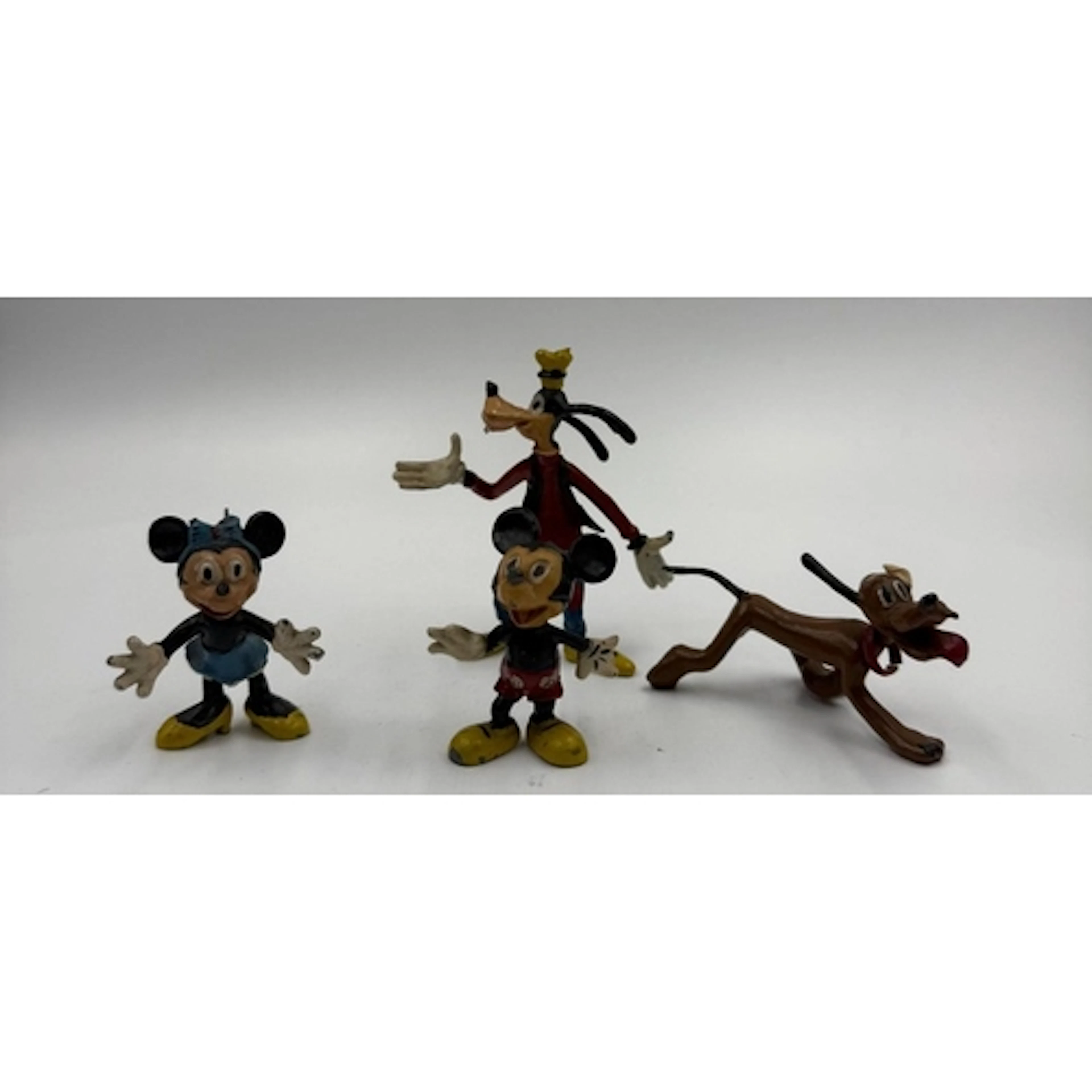 A set of four Sacul Disney figures to include Mickey and Min...