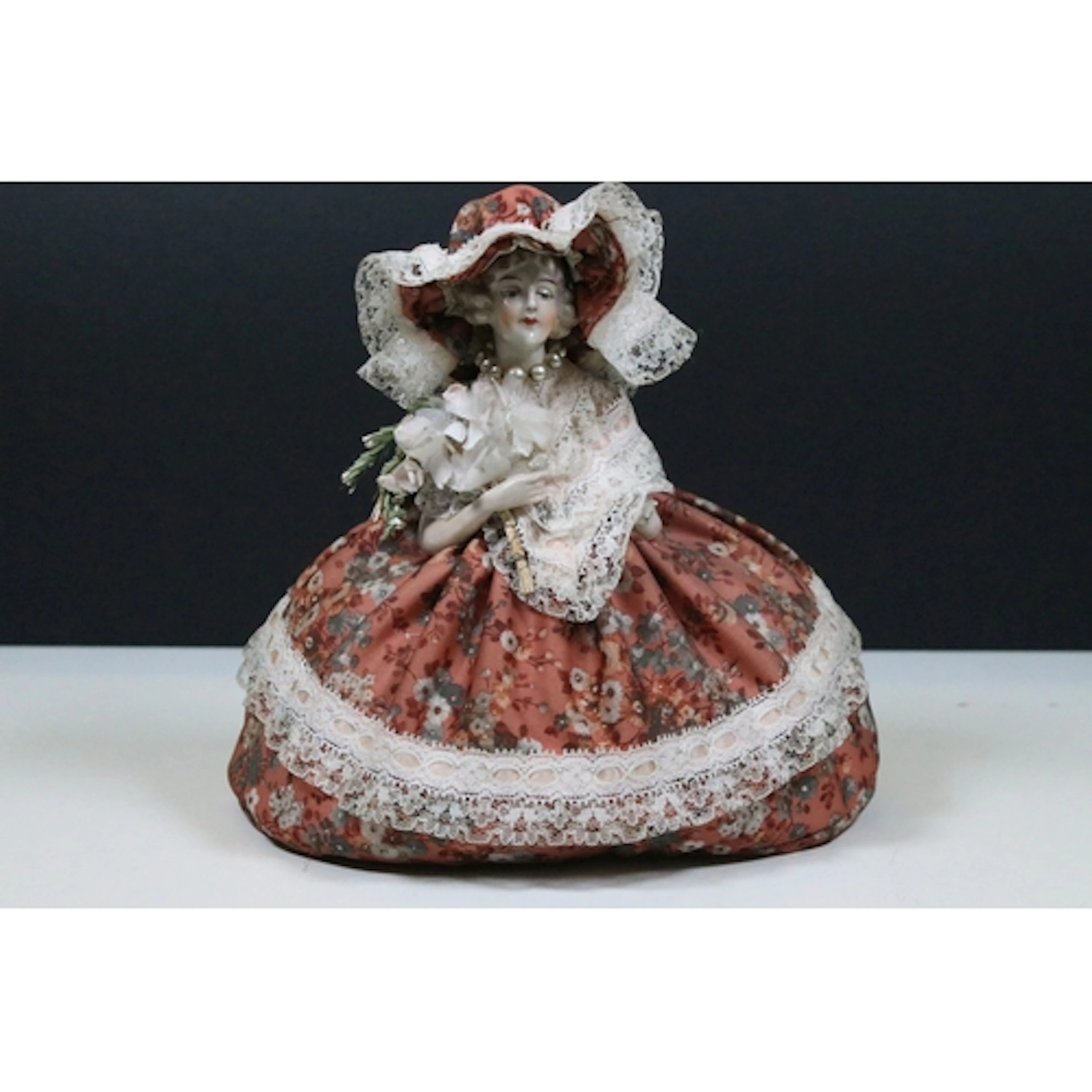 Early 20th century porcelain tea cosy half doll with hand-st...