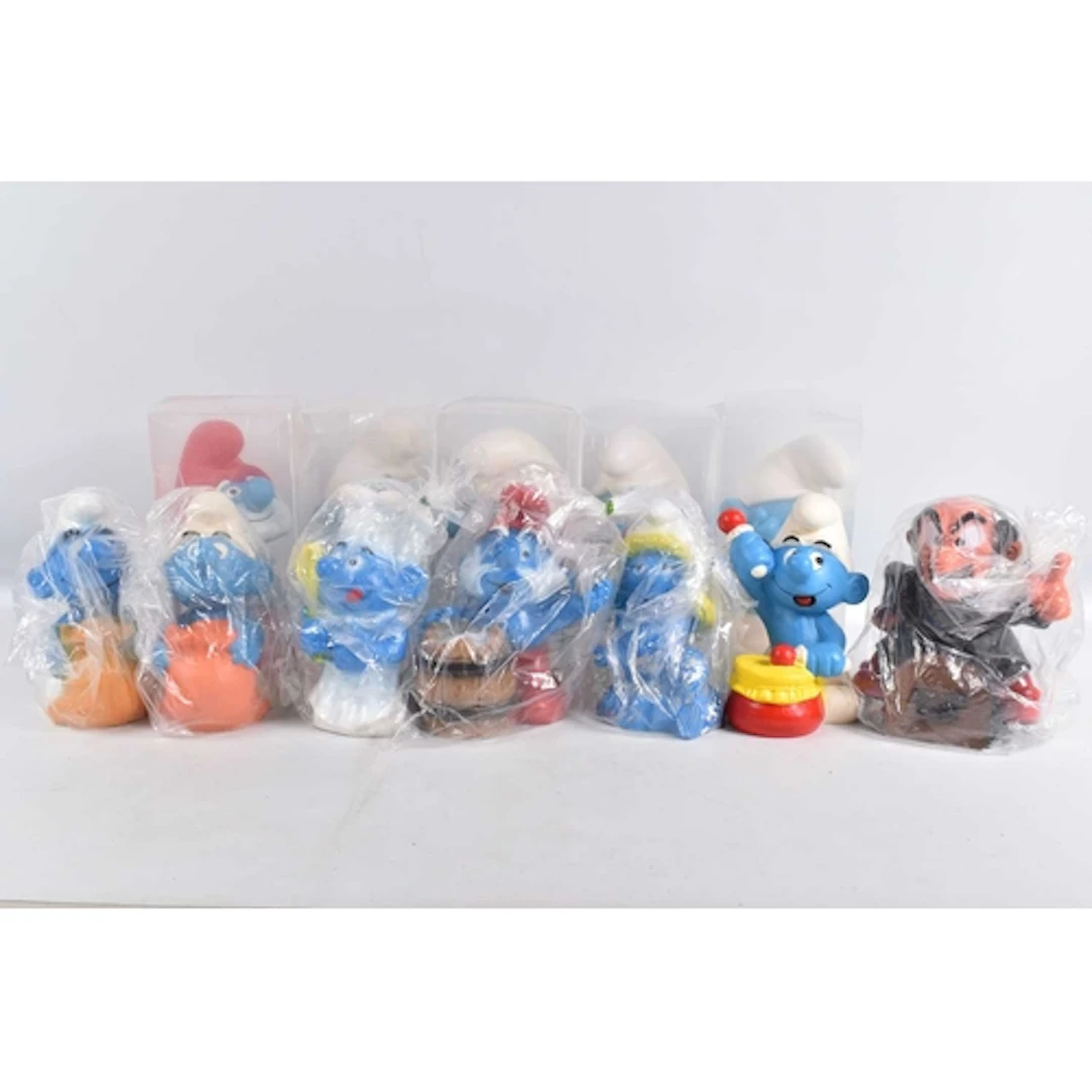 A COLLECTION OF SMURF FIGURES AND MONEY BOXES, to include se...