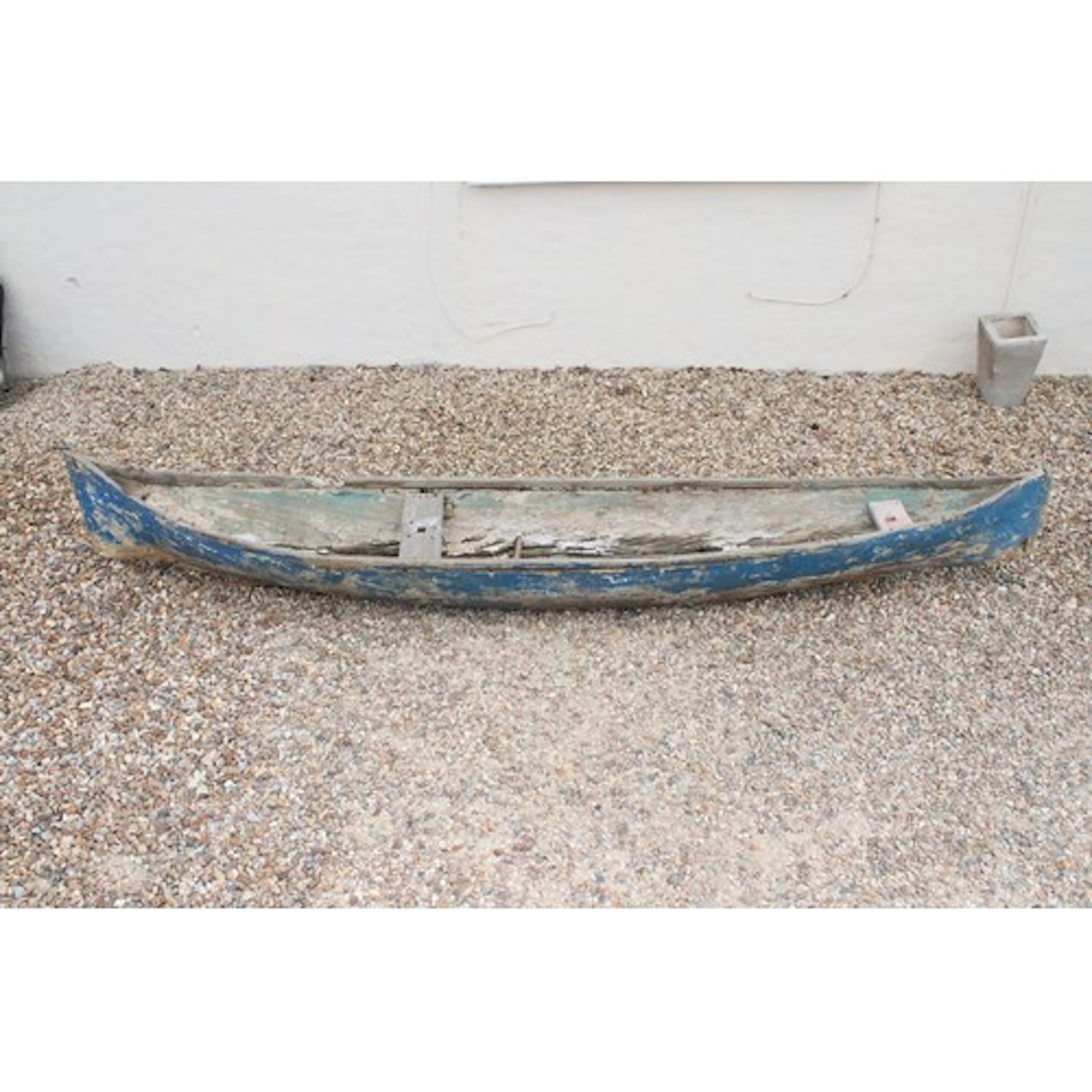 Painted wooden canoe, having seats to the interior, blue pai...