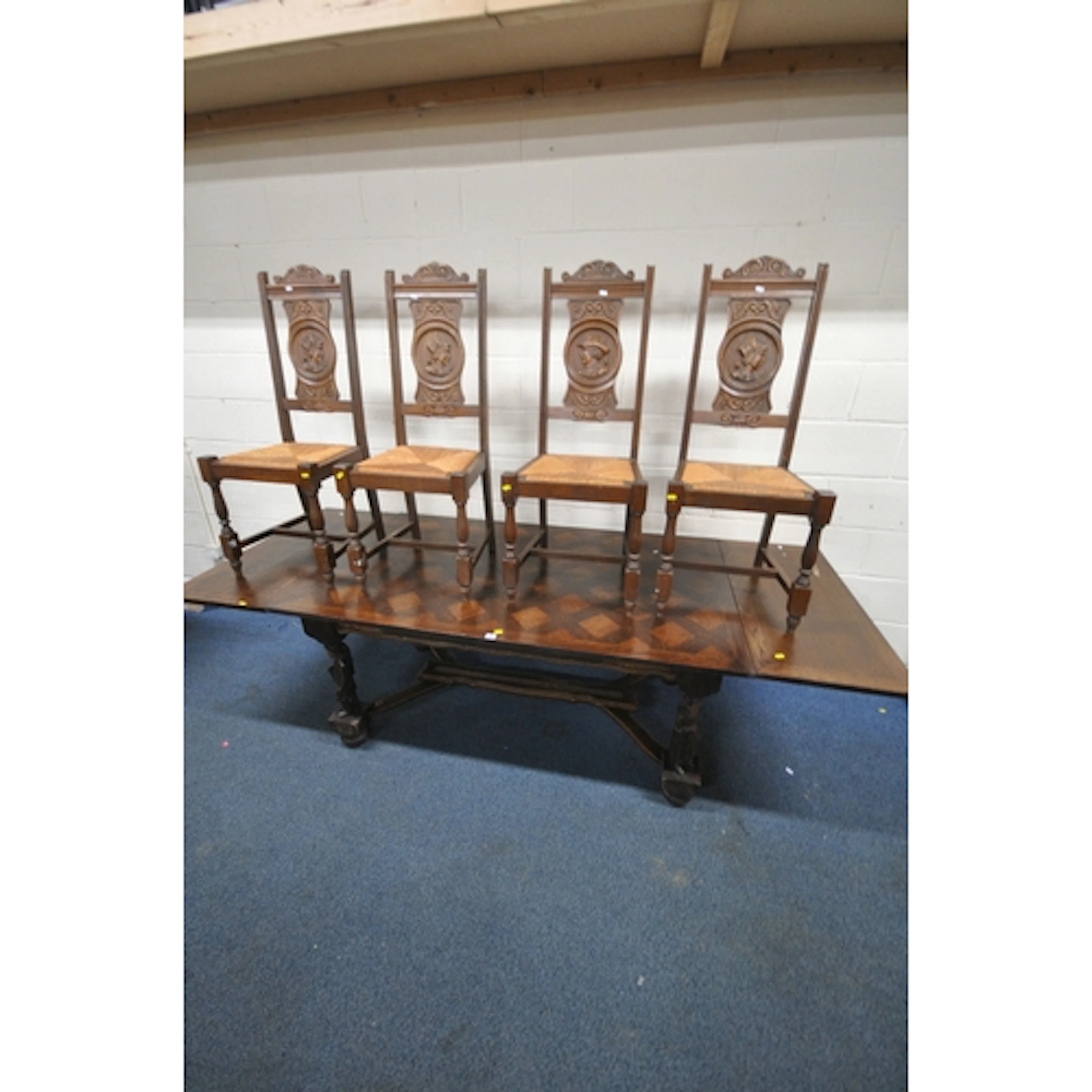 AN EARLY 20TH CENTURY OAK DRAW LEAF BRETON TABLE, raised on ...