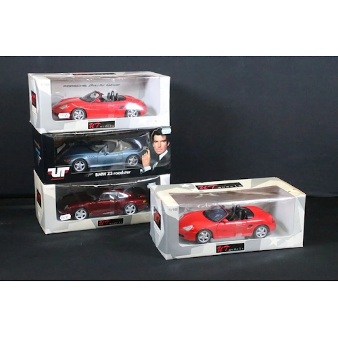 Four boxed 1/18 UT Models diecast models to include James Bo...