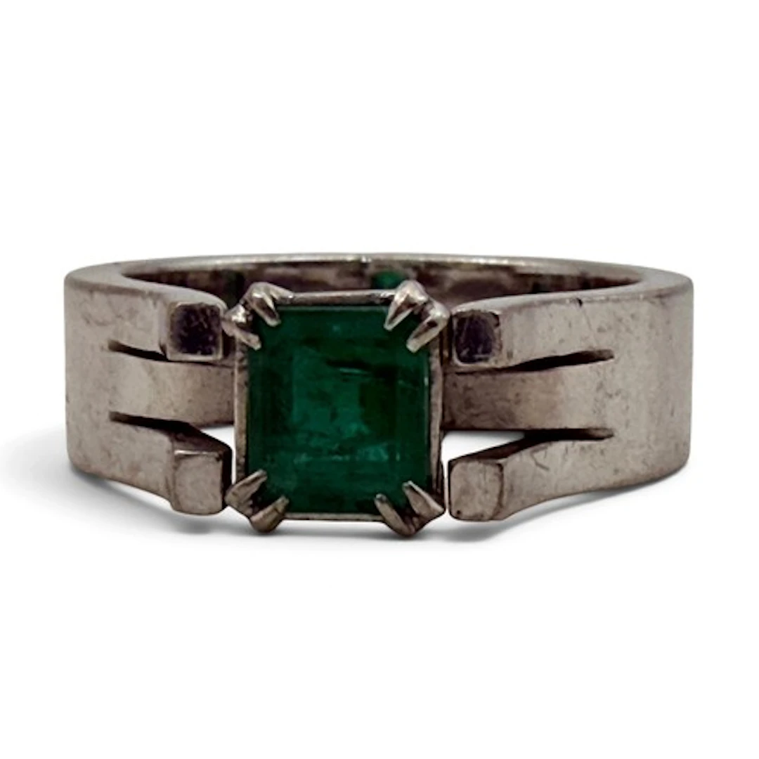 An emerald ring, four corner claw-set with an emerald-cut em...