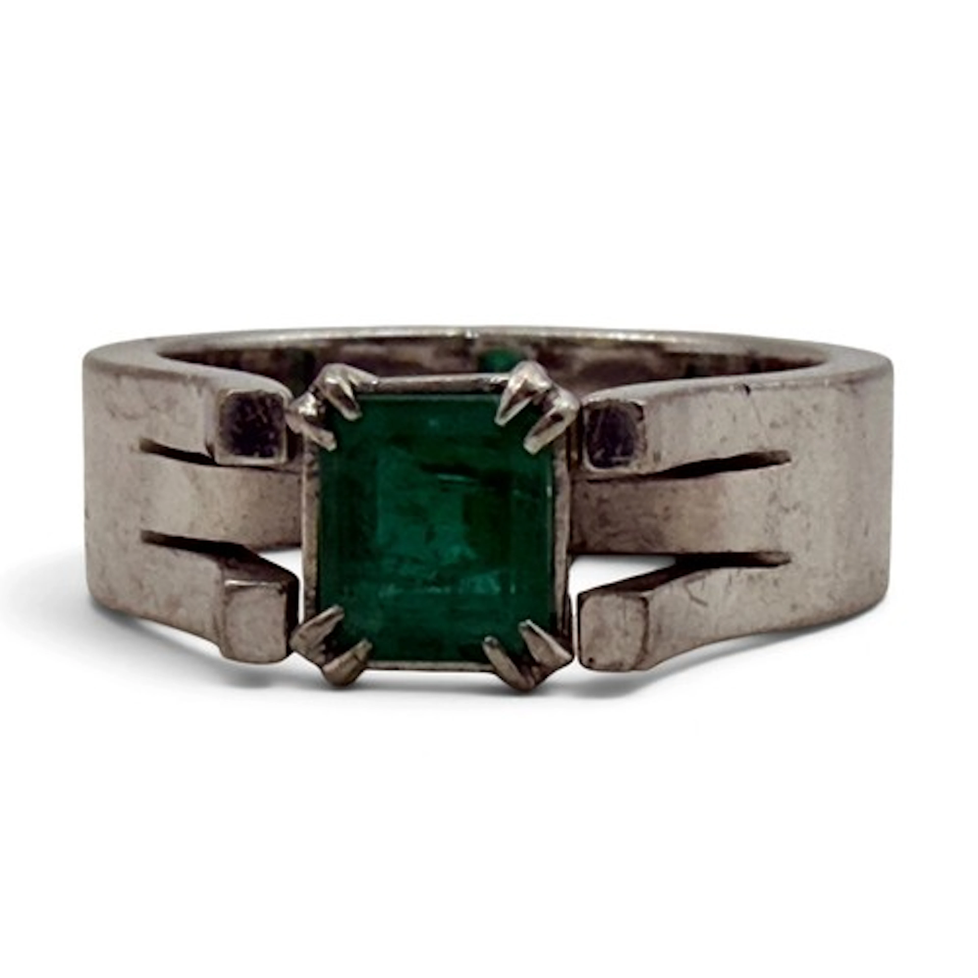An emerald ring, four corner claw-set with an emerald-cut em...