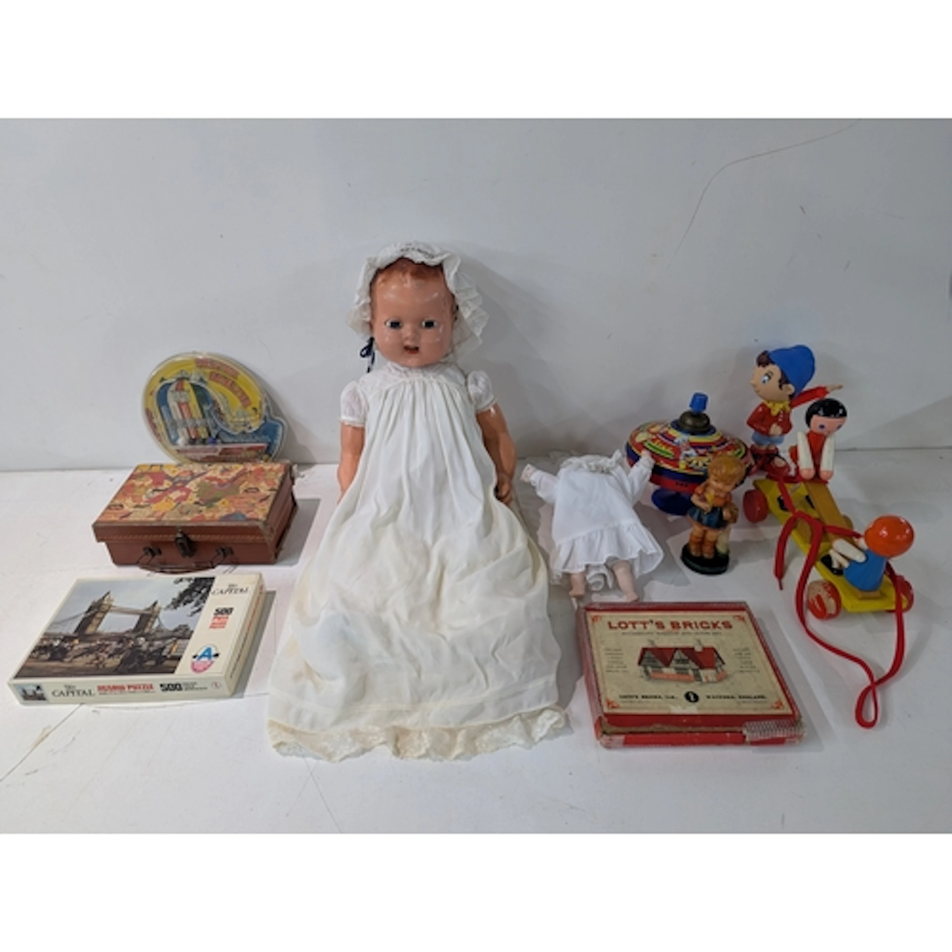A mixed lot to include; Lott's Bricks, two dolls, a Helter S...