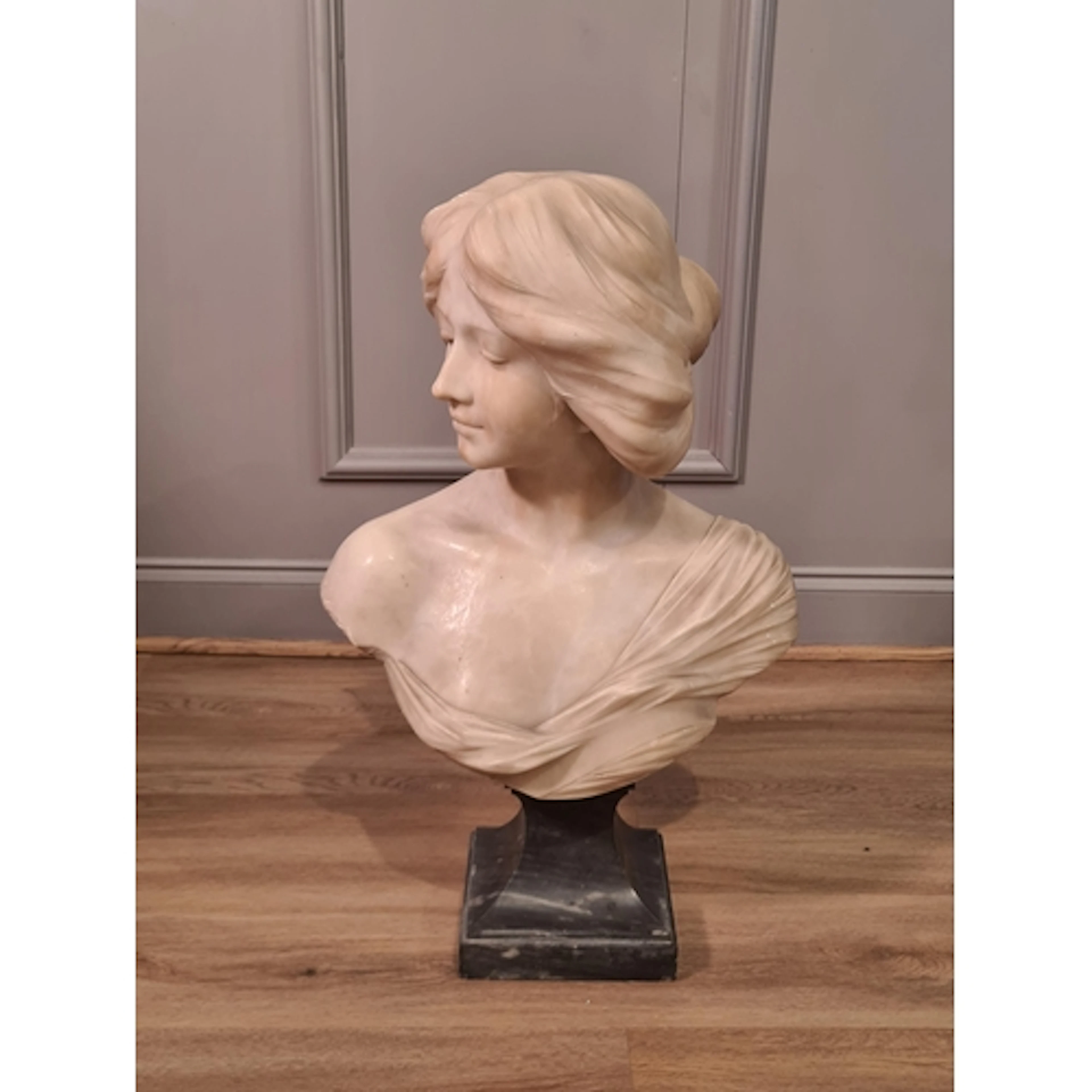 ****AMENDMENT**** After Pisani, an alabaster Bust of a young...