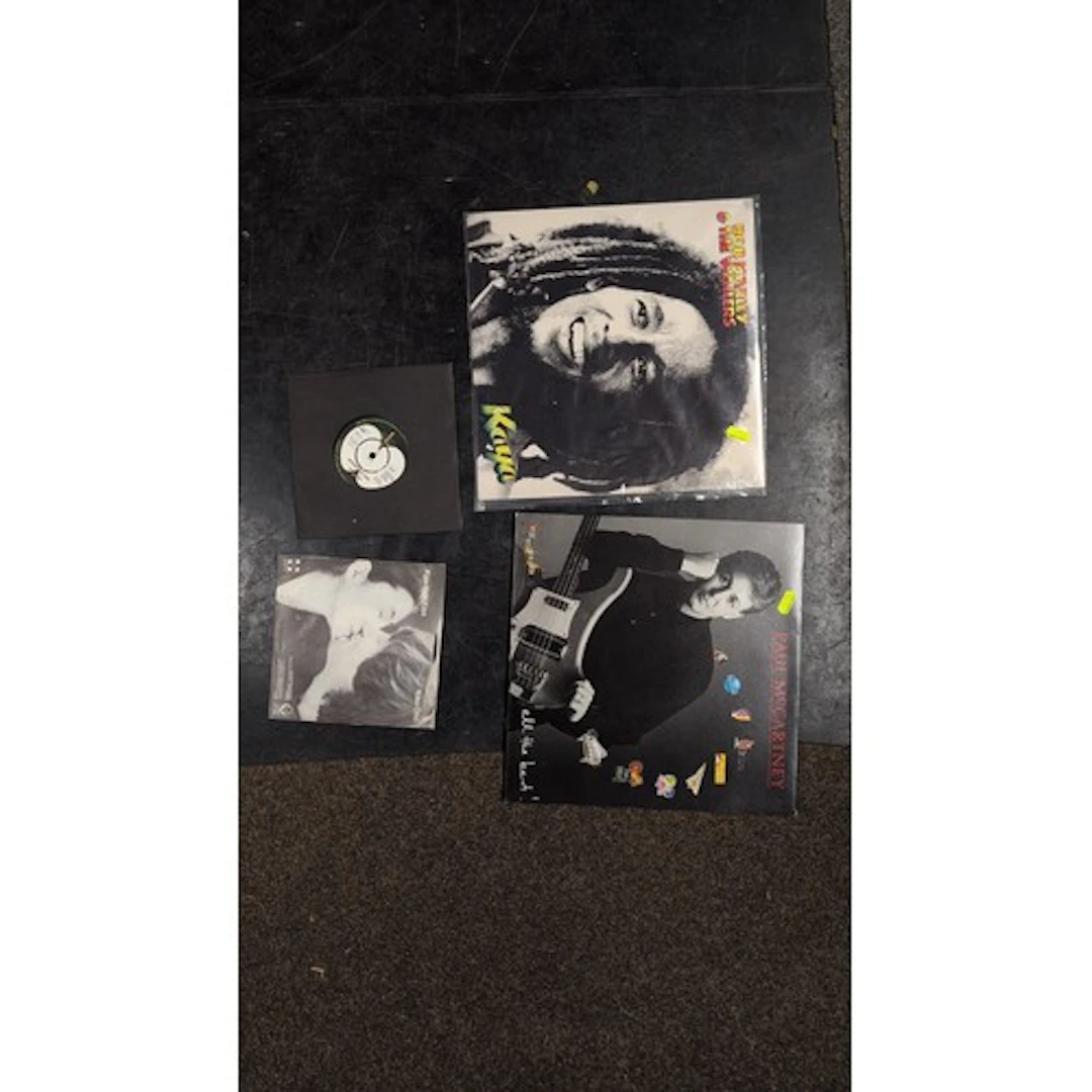 A group of vinyl records and sleeves: Bob Marley & the Waile...