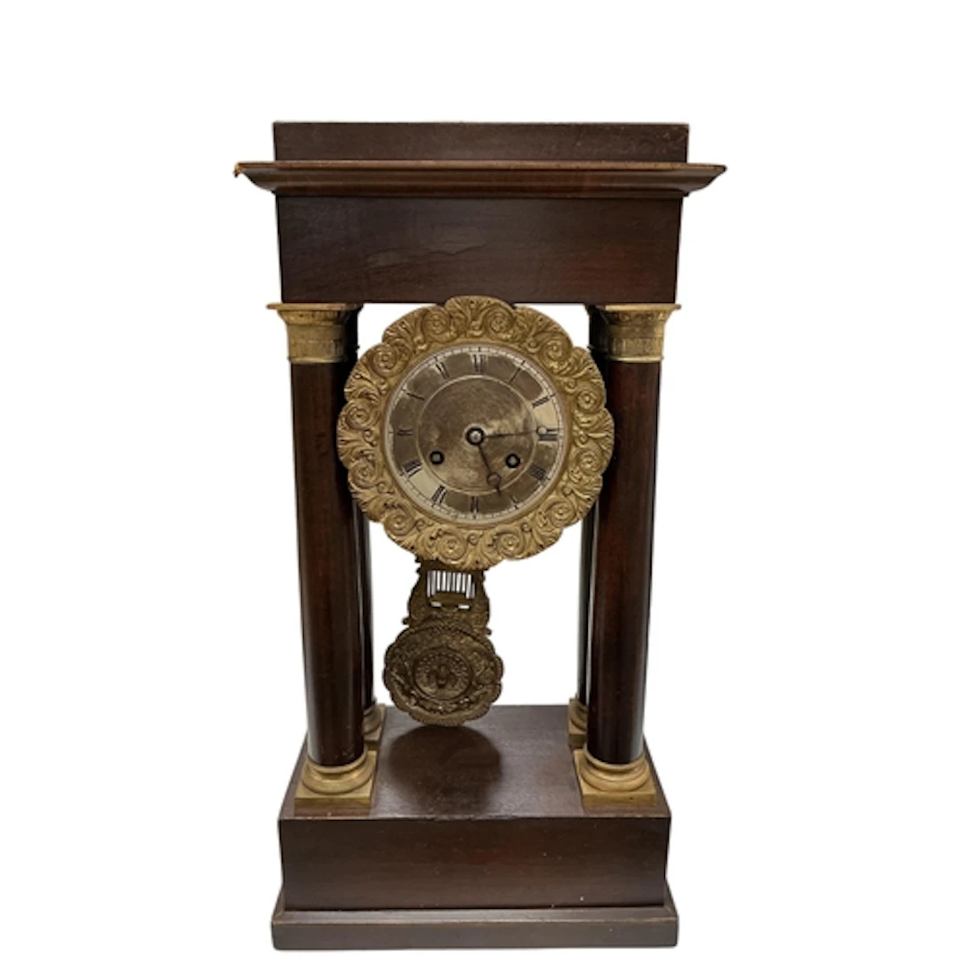 A 19th century French Empire mahogany portico clock, height ...