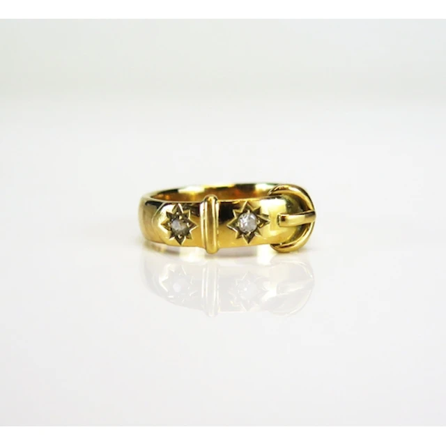 A Victorian buckle ring set with two European cut diamonds i...