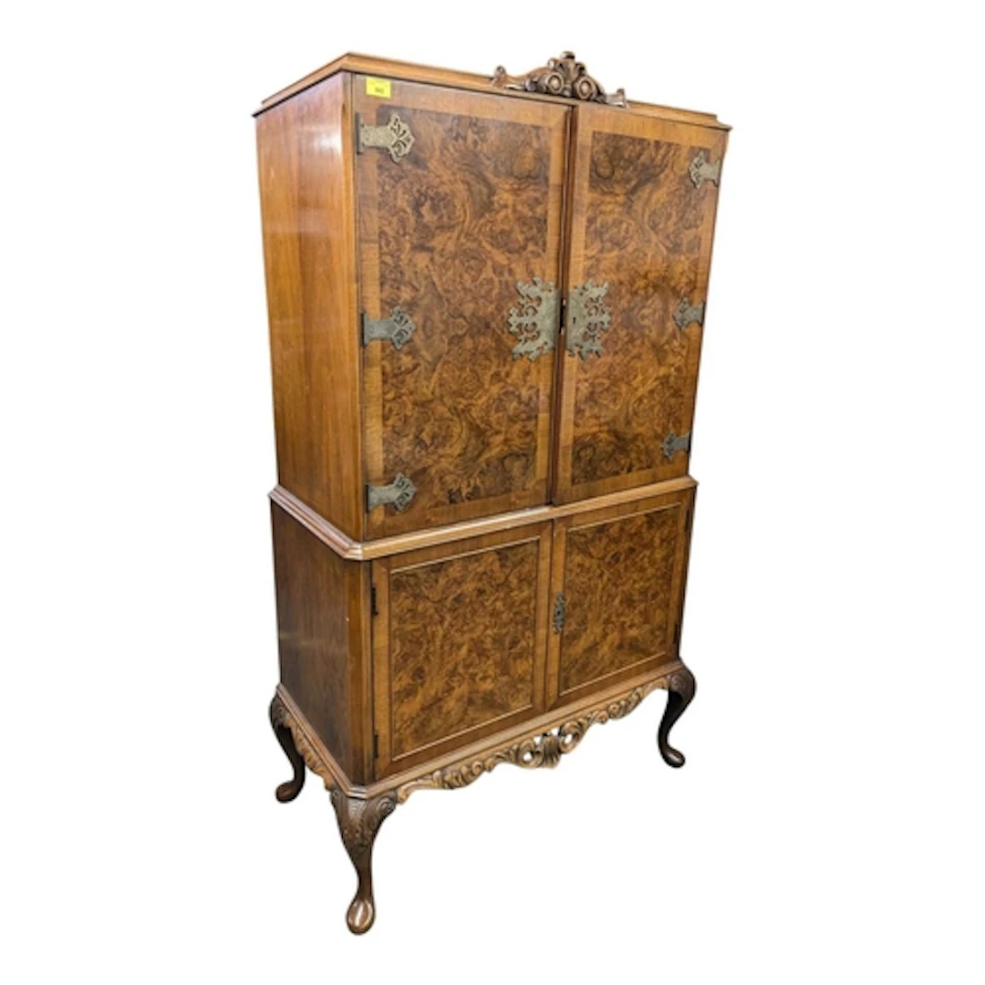 A vintage 20th century Queen Anne style walnut drinks cabine...