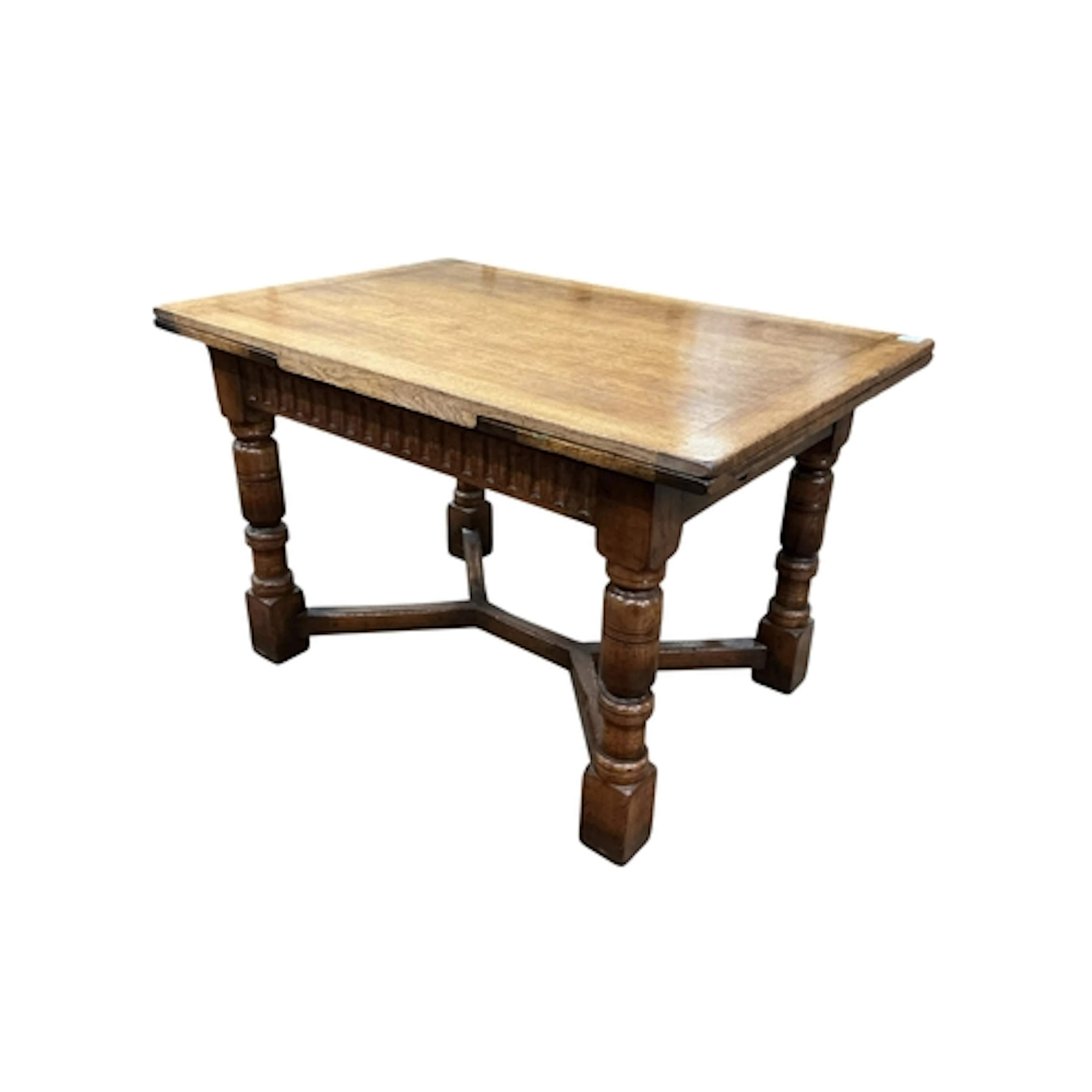 A 1920s oak draw leaf dining table and six Lancashire style ...