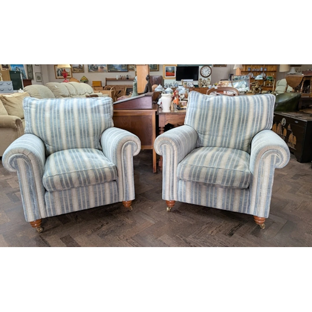 A pair of Duresta armchairs, the feather filled cushions uph...