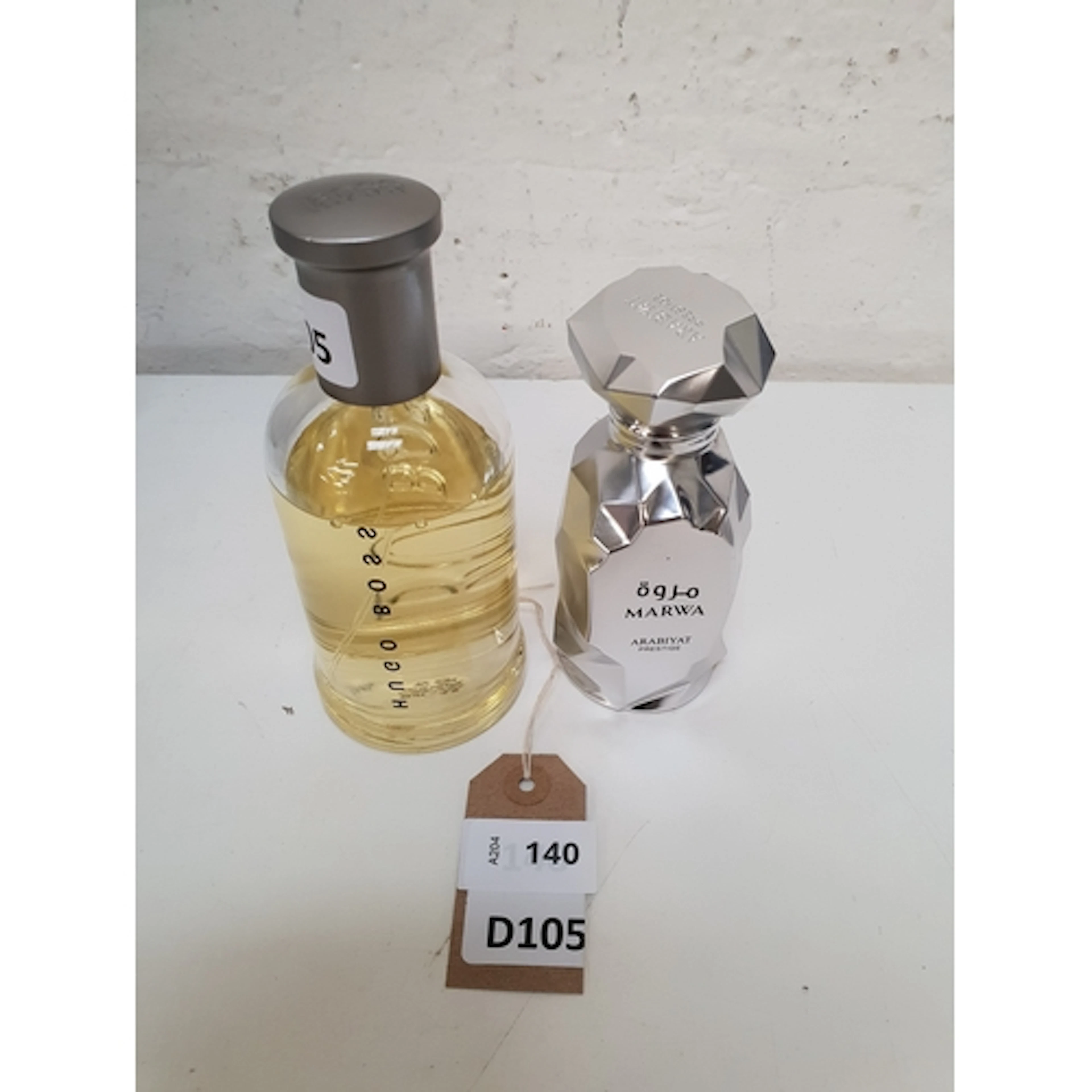 TWO PRE-OWNED PERFUME COMPRISING HUGO BOSS EAU DE TOILETTE A...