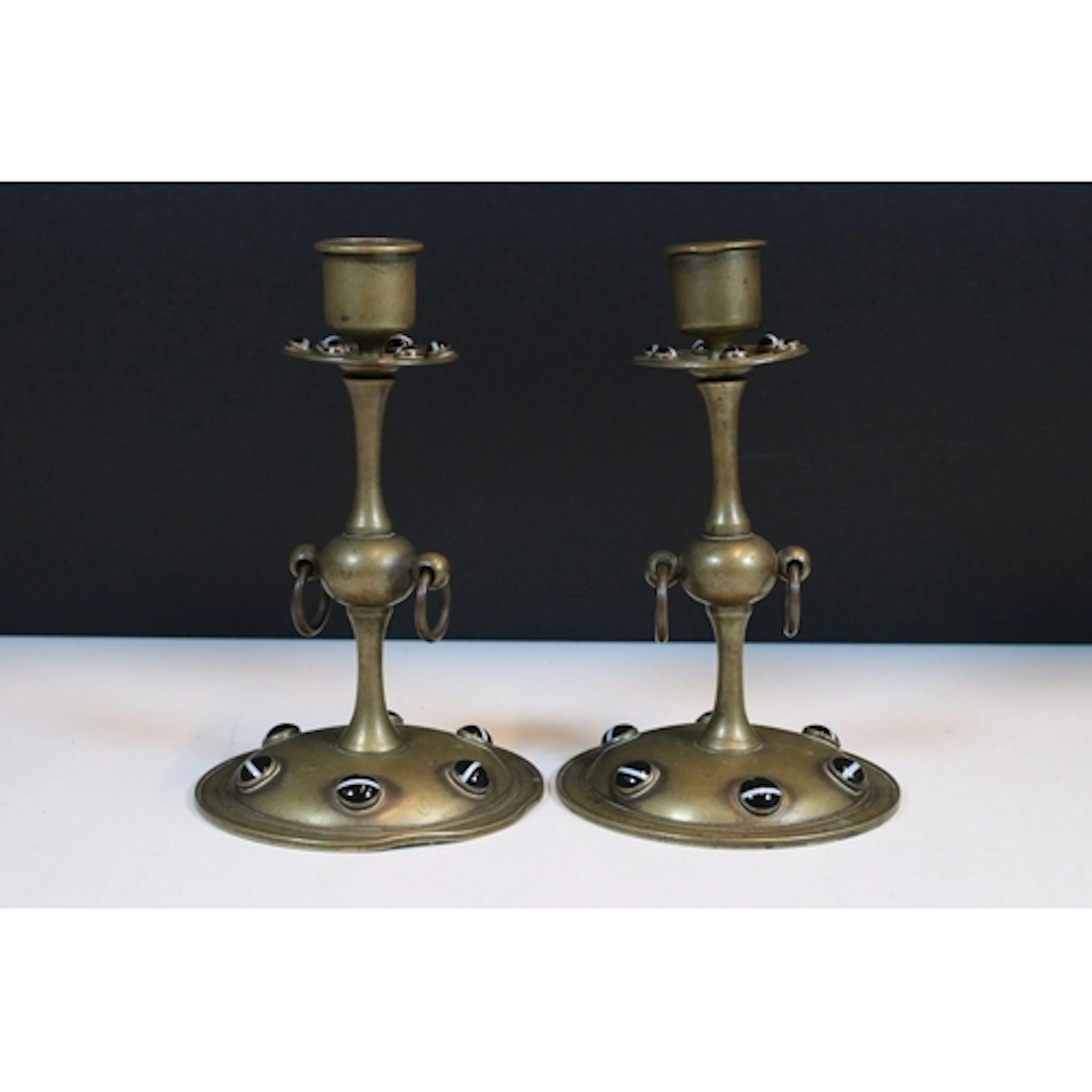 Pair of 20th century brass candlesticks, each with twin swin...