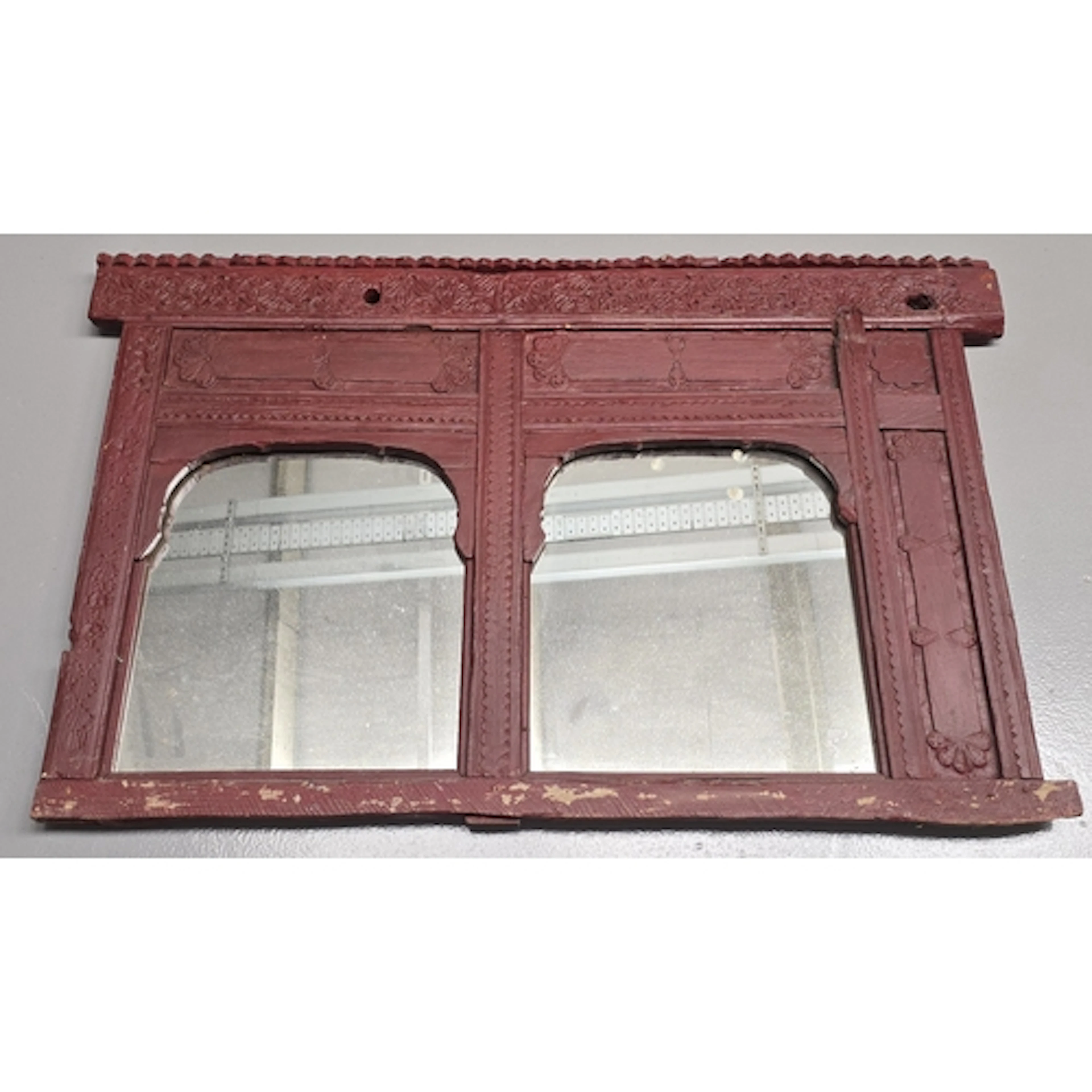 A vintage rustic hand carved Indian wooden mirror featuring ...
