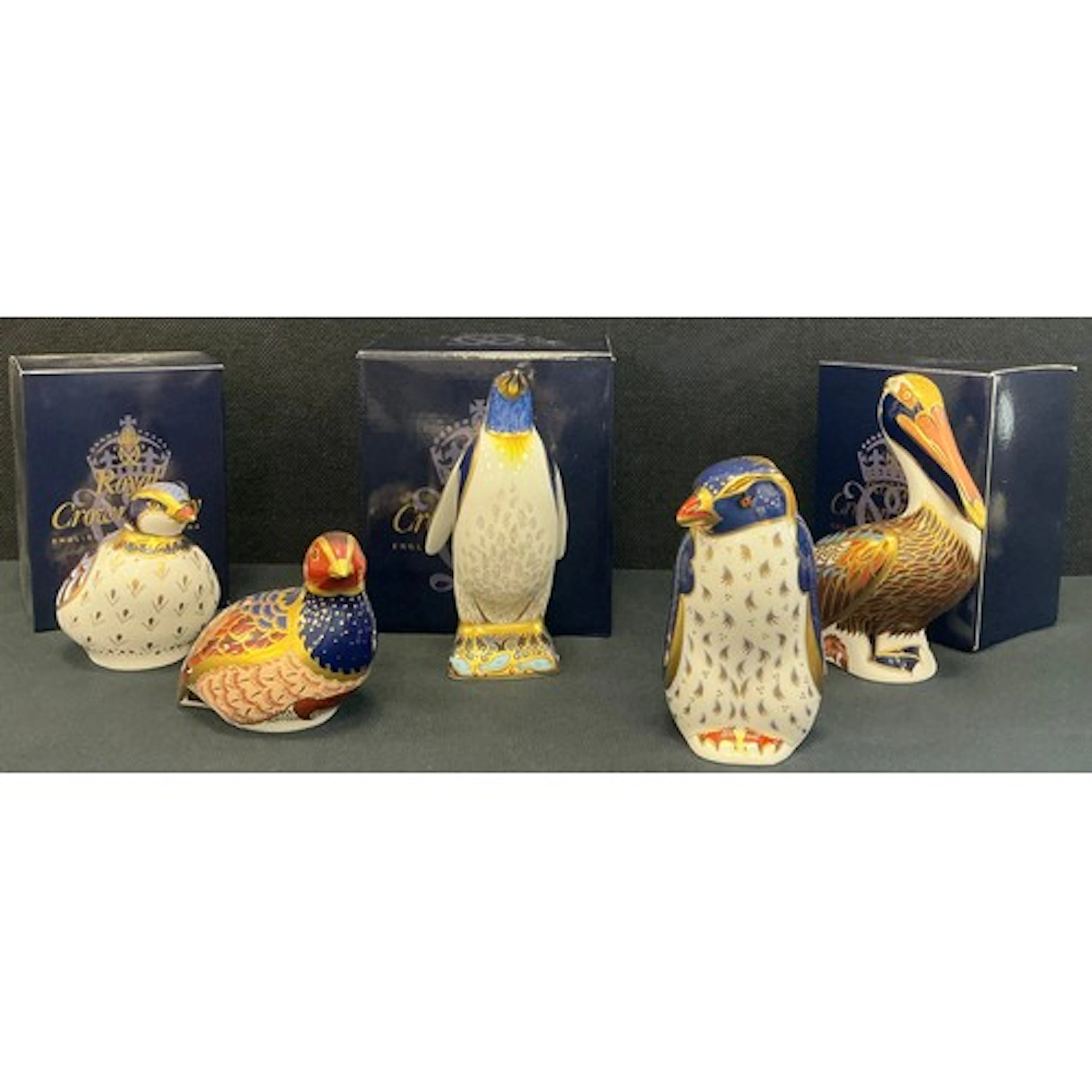 A Royal Crown Derby paperweight Emperor Penguin, gold stoppe...