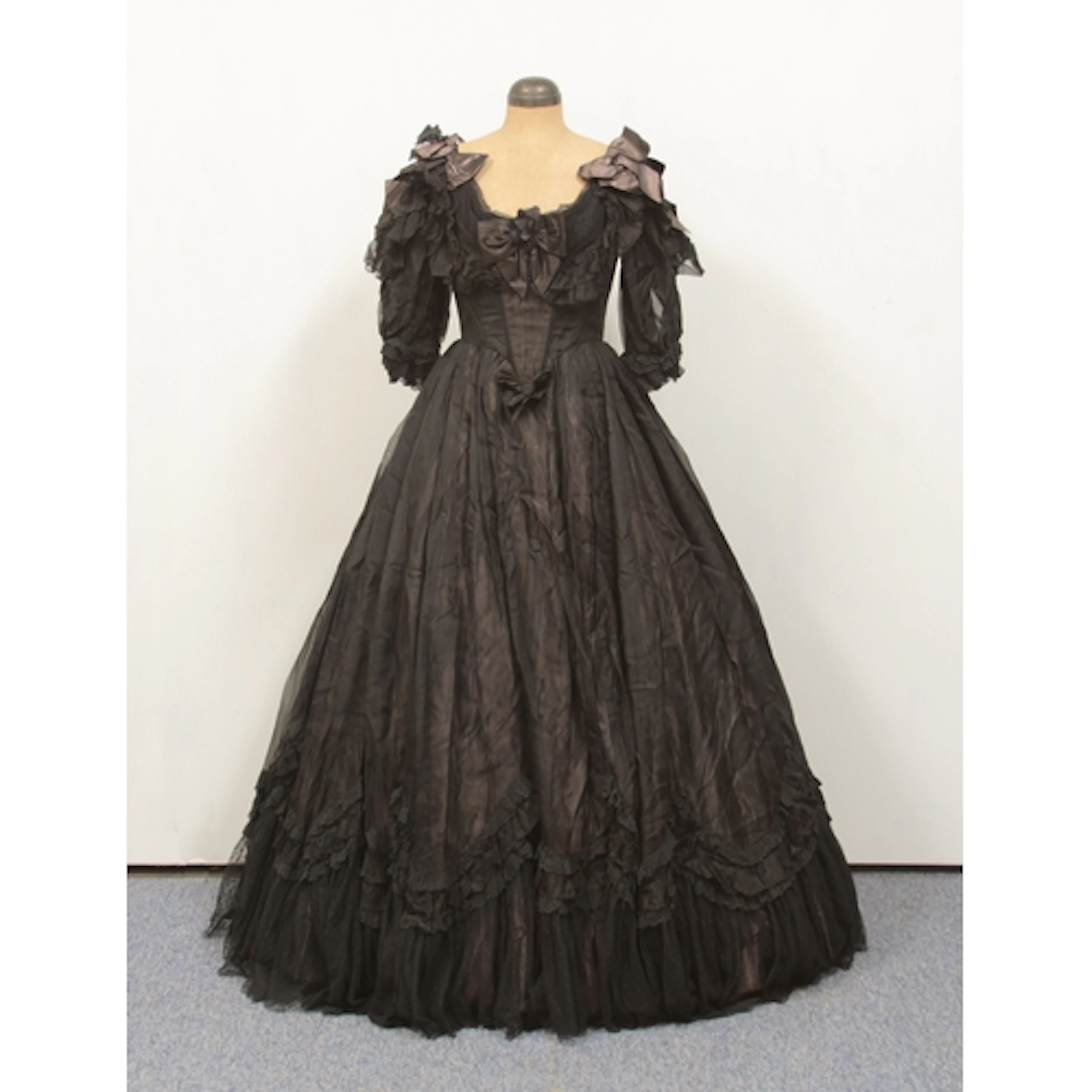 An elaborate Victorian style, full length dress with pettico...