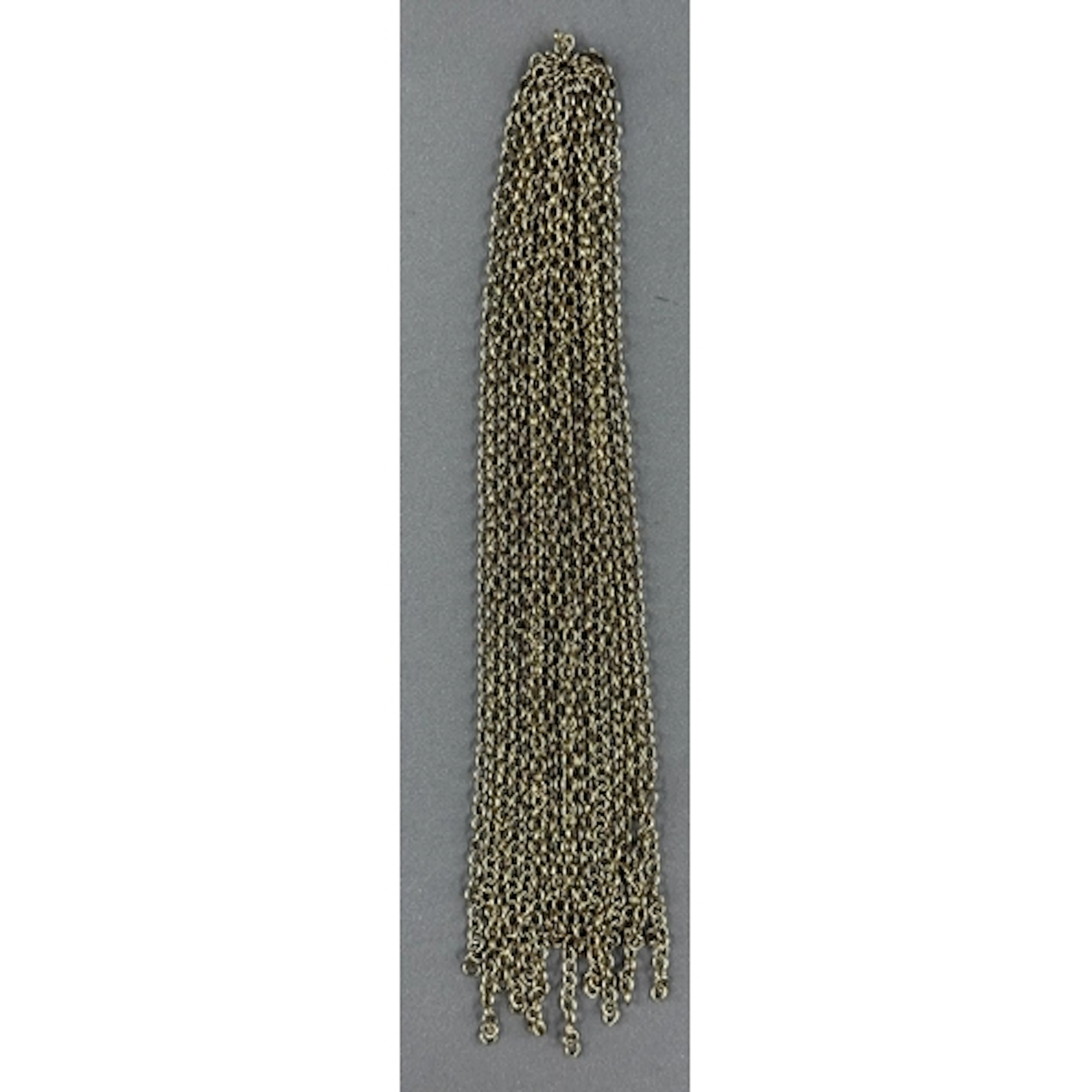 Jewellery: a number of yellow metal chains attached to a cen...
