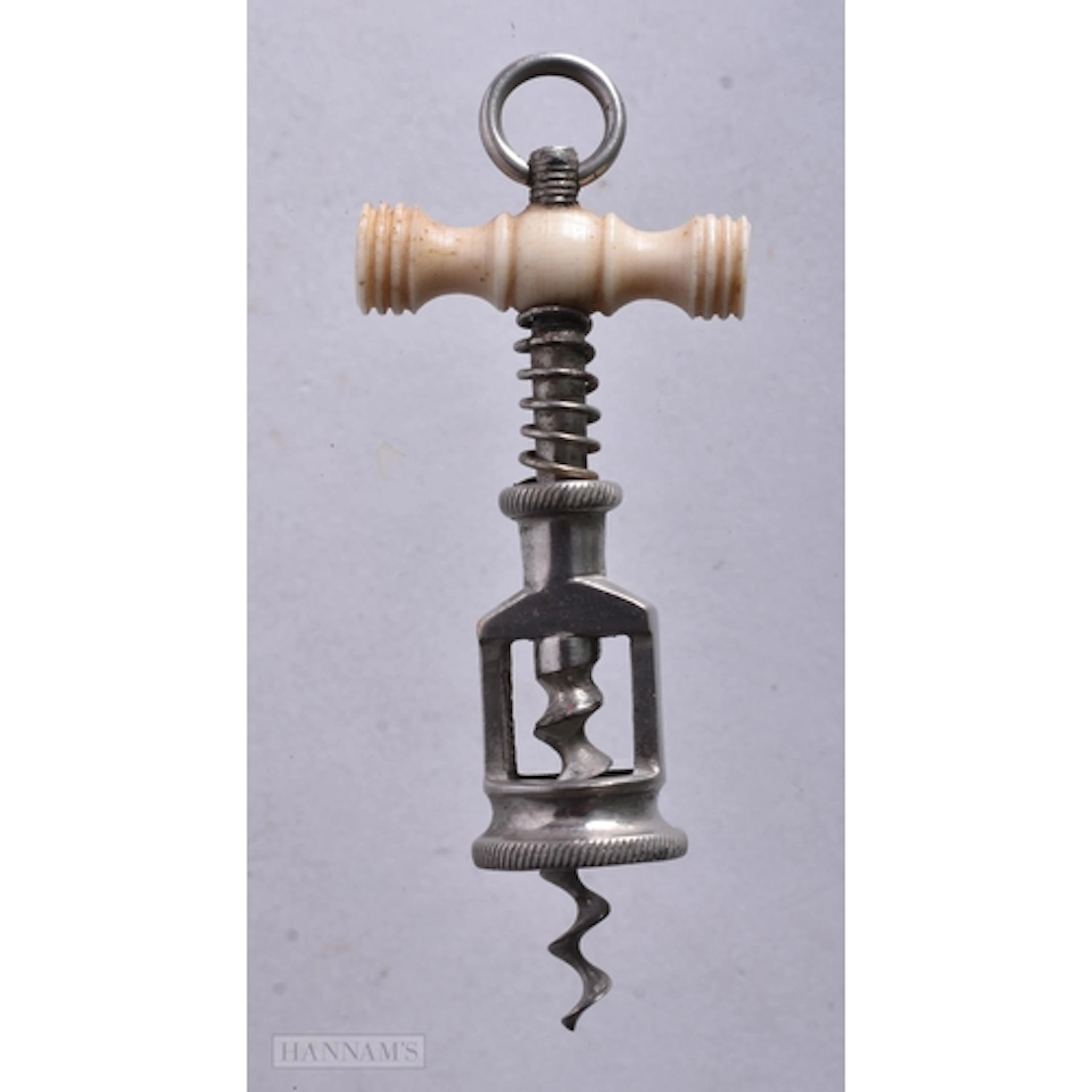 A VERY RARE George III MINIATURE CORKSCREW. 5 cm x 2.75 cm.