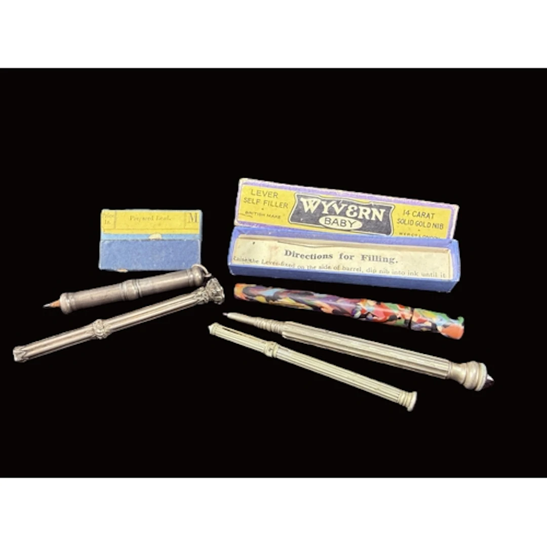 A Samuel Mordan white metal propelling pencil with seal ston...
